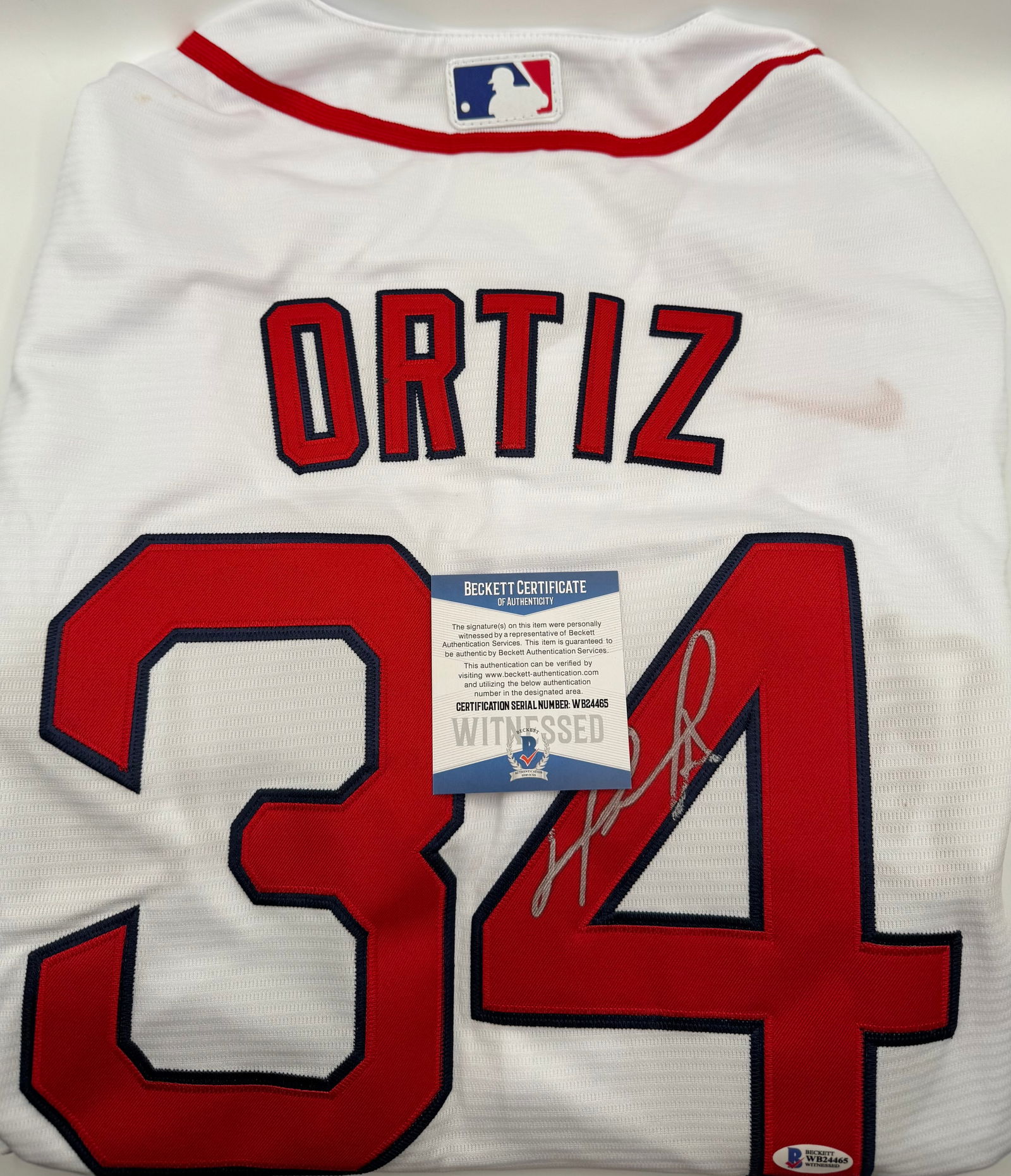 DAVID ORTIZ Signed Boston Red Sox Jersey - Beckett WITNESSED BAS: Up for auction is a premium piece of baseball history: a David Ortiz ("Big Papi") hand-signed Boston Red Sox jersey. This signature is bold, clear, and executed in silver paint marker on the jersey's