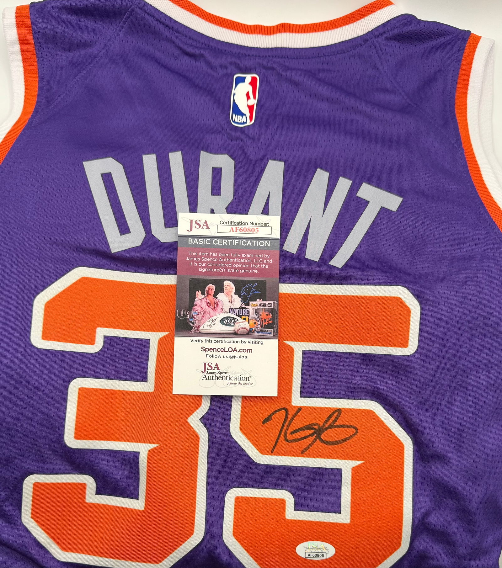 KEVIN DURANT Signed Phoenix Suns Jersey - JSA Certified: A premier addition to any NBA collection: an authentic Kevin Durant hand-signed Phoenix Suns jersey. The signature is clean and bold, executed in black ink on the jersey's back