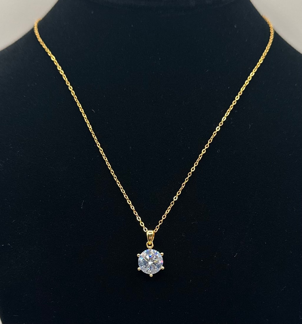 4.00ct Round Brilliant Cut Moissanite Pendant Necklace - 18K Gold over .925 Silver - GRA Certified: Center Stone: Genuine Moissanite • Carat Weight: 4.00 Carats • Stone Color: Blue • Clarity: VVS1 (Eye-clean) • Cut: Excellent • Metal: 18K Yellow Gold Plated over