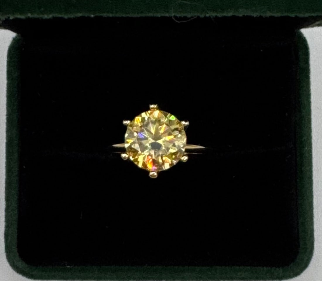 Rare 5.00 CTW Fancy Canary Yellow Moissanite Solitaire Ring - GRA Certified: Stone: 5 Carat Round Cut Fancy Yellow Moissanite. • Metal: 18K Yellow Gold plating over Solid .925 Sterling Silver. • Setting: 6-Prong Solitaire. • Certification: Includes GRA
