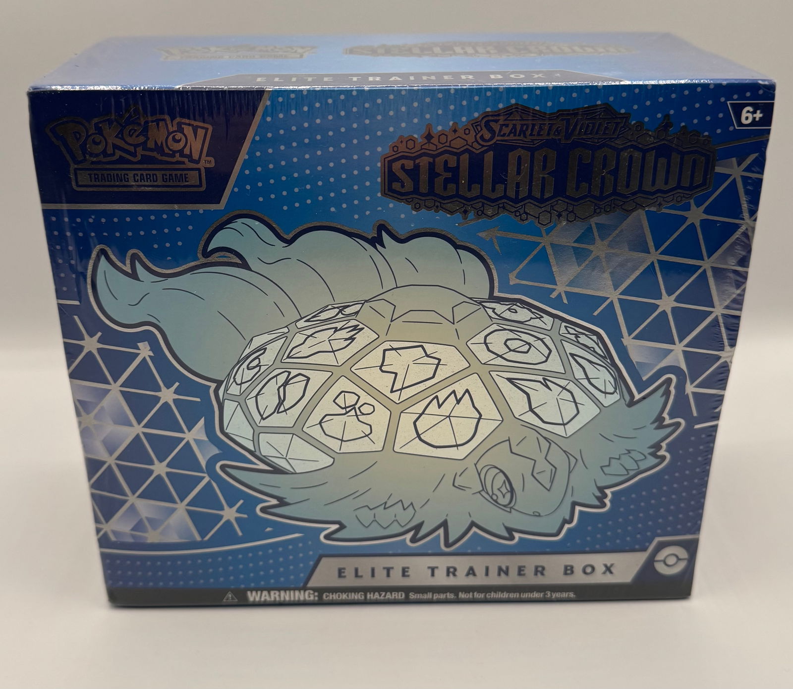 Pokémon TCG Scarlet & Violet Stellar Crown Elite Trainer Box (ETB) - Factory Sealed: Expansion: Scarlet & Violet—Stellar Crown • Condition: Factory Sealed / New in Shrink • Featured Pokémon: Terapagos (Stellar Form) • Contents: Includes 9 Pokémon TCG: