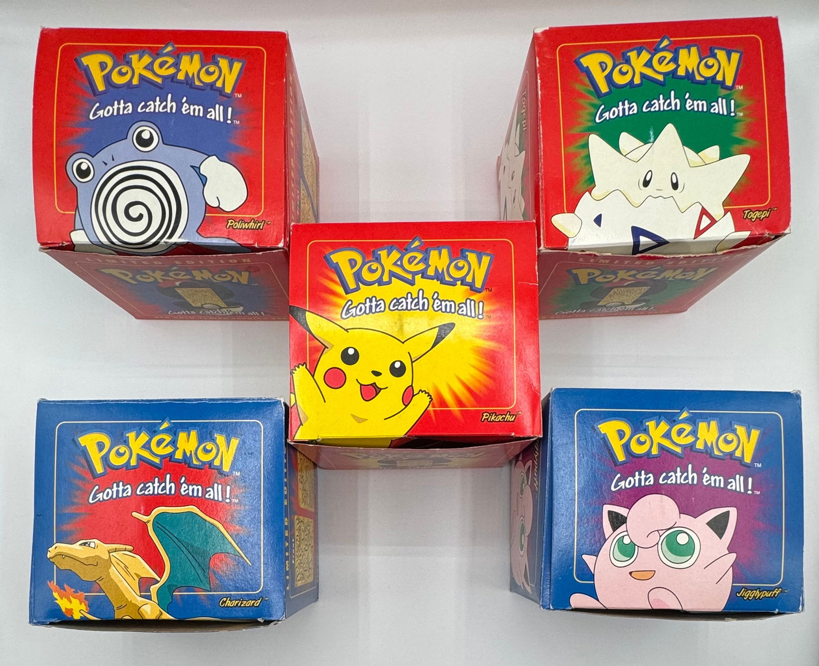 1999 Charizard , Pikachu , Jigglypuff Sealed Pokemon Collection: 1999 Nintendo Pokemon Balls Charizard, Pikachu, Jugglypuff, Togepi And poliwhirl limited edition pokemon trading cards. Two of them are sealed And they all come with trading cards and certificates 