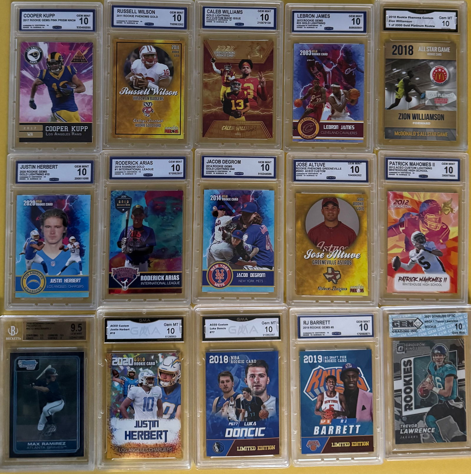 15-Card Graded Sports Lot - Mahomes, Doncic, LeBron, Kupp - Custom ACEO/Rookie Gems: Patrick Mahomes II, Luka Doncic, LeBron James, Cooper Kupp, Justin Herbert (x3), Russell Wilson, Zion Williamson, Trevor Lawrence, and more. This auction is for a collection of 15 slabbed and graded