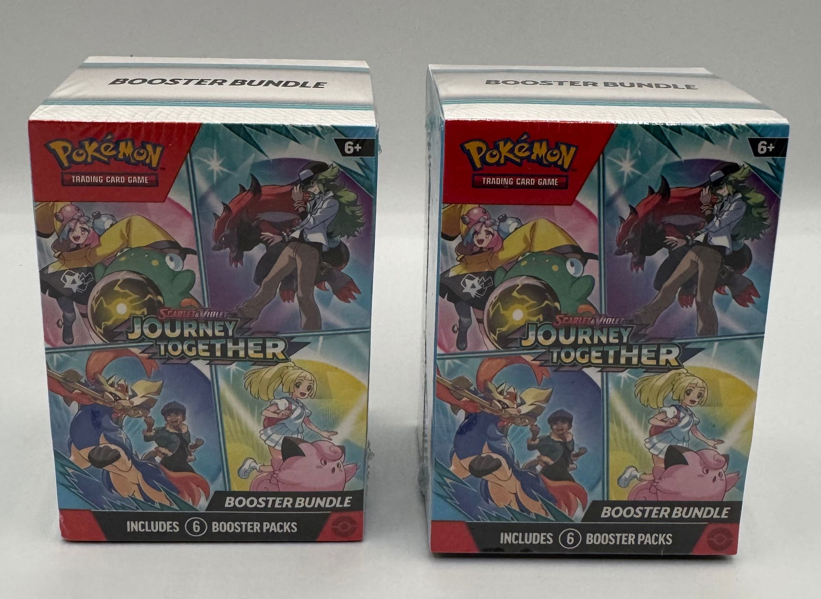 (2) Sealed Pokémon TCG: Scarlet & Violet Journey Together Booster Bundles: This lot includes two (2) factory-sealed Pokémon Trading Card Game: Scarlet & Violet "Journey Together" Booster Bundles. Each bundle contains six (6) individual booster packs, for a total of 12 p