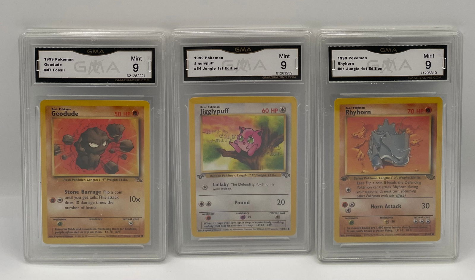 Lot of (4) Graded 1999 Pokémon Cards: PSA 6 1st Ed Pikachu & (3) GMA Mint 9 Classics: This lot features four professionally graded Pokémon trading cards from the iconic 1999 era. This collection includes a highly sought-after 1st Edition Jungle Pikachu graded by PSA, alongside thr