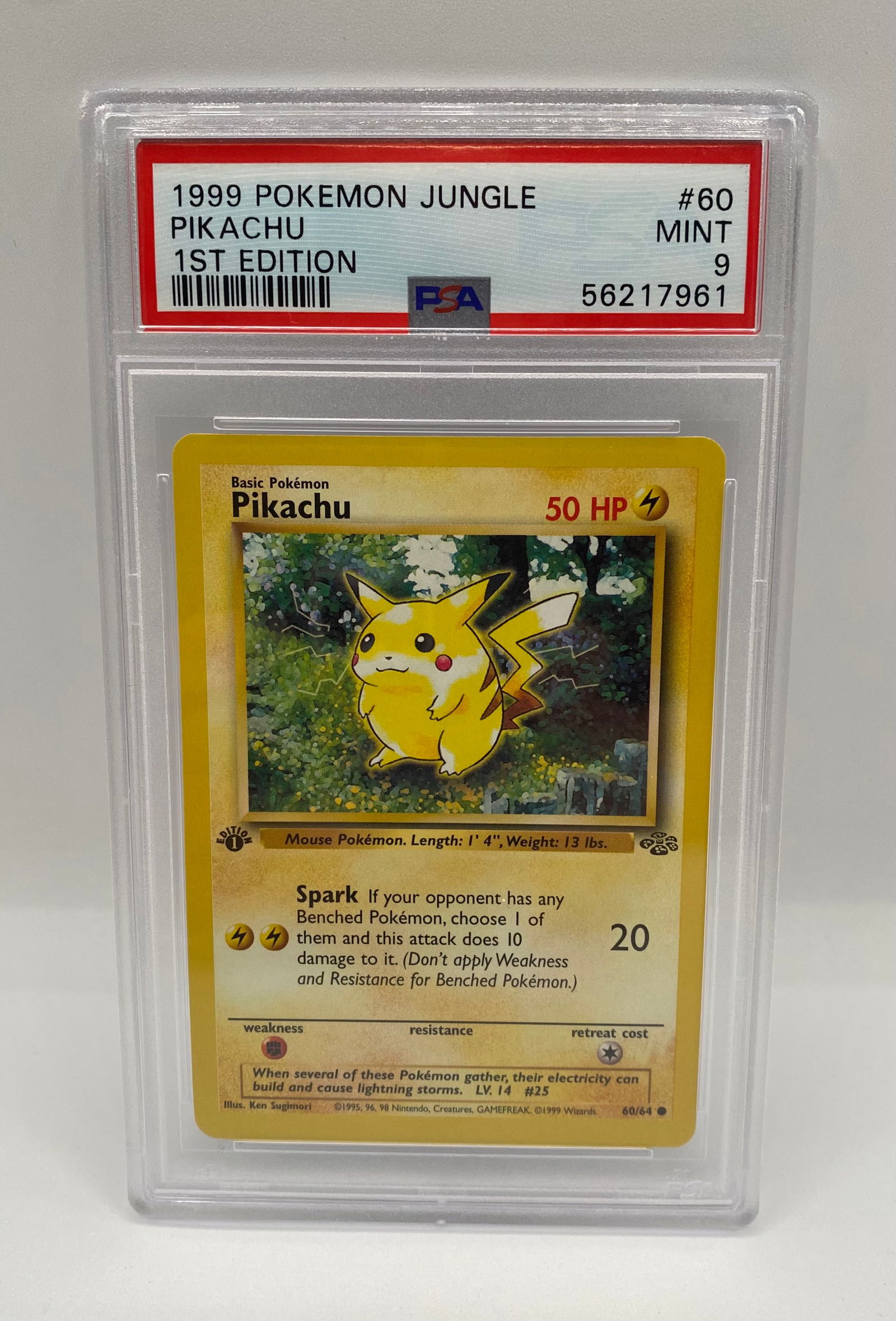 1999 Pokemon Jungle 1st Edition Pikachu #60 - PSA 9 MINT - WOTC Vintage: A true holy grail for vintage collectors: a 1st Edition Pikachu from the 1999 Jungle expansion. • Grade: PSA 9 (Mint) • Card Number: 60/64 • Key Features: Features the classic