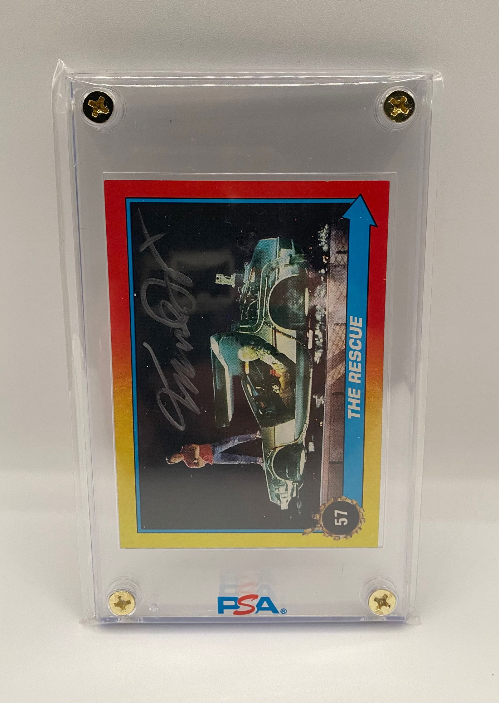 Signed Topps Back to the Future #57 "The Rescue" Card: A classic vintage Topps card from the Back to the Future series, titled "The Rescue," featuring the iconic DeLorean time machine. The card features a bold on-card signature and is preserved in a