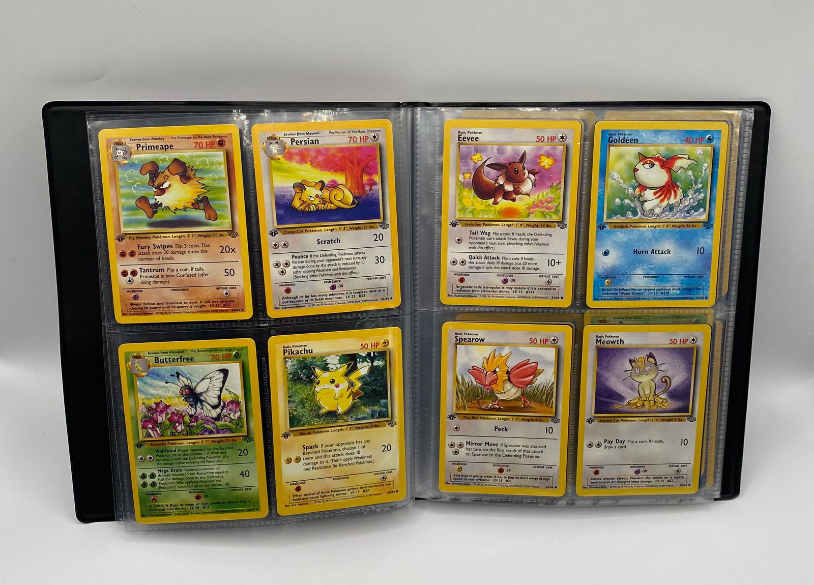 Lot of (32) Vintage 1st Edition Pokémon Cards - 1999 Jungle Set: Up for auction is a high-quality selection of 32 first edition vintage Pokémon Trading Cards from the iconic 1999 Jungle Set. This collection has been collector-kept in a protective binder and