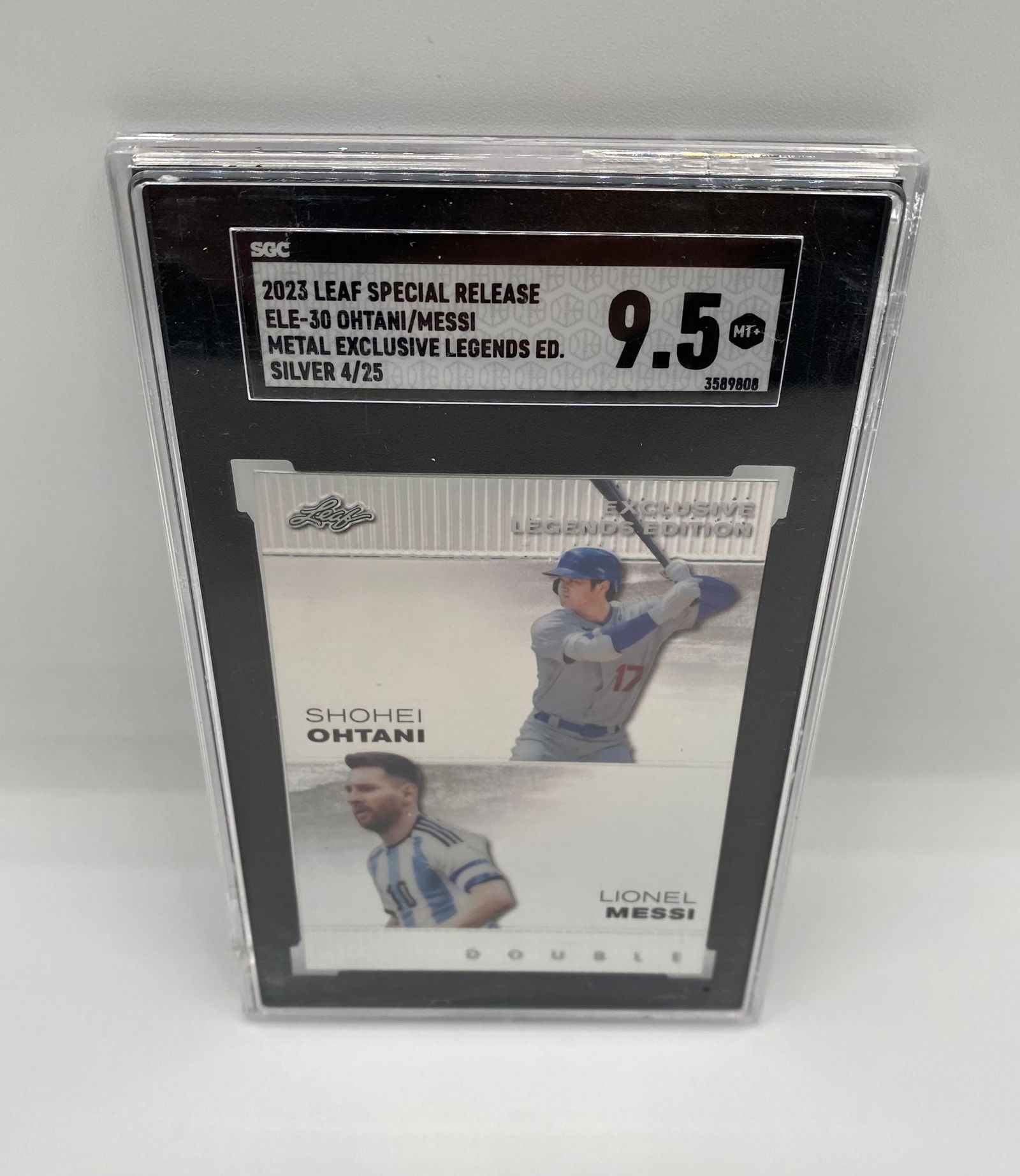 2023 Leaf Special Release Shohei Ohtani & Lionel Messi Silver /25: Rare "Dual GOAT" card featuring Shohei Ohtani and Lionel Messi. This Metal Exclusive Legends Edition is the Silver Parallel, serial numbered 4/25. Professionally graded by SGC 9.5 Mint+. A premier