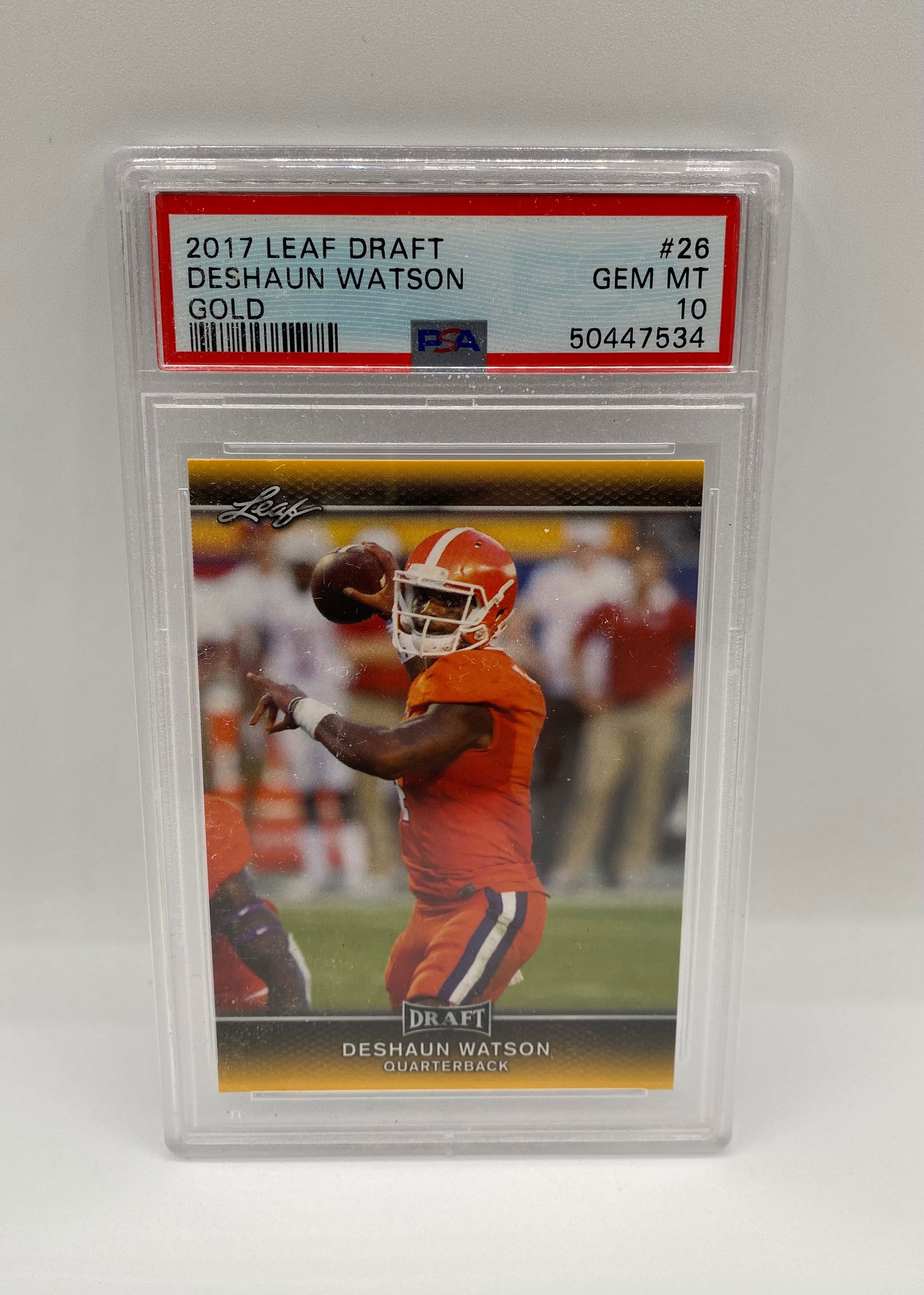 2017 Leaf Draft Deshaun Watson Gold #26 - PSA 10 GEM MINT: A stunning GEM MINT 10 example of Deshaun Watson’s 2017 Leaf Draft Gold parallel. This card features the quarterback in his Clemson collegiate jersey and boasts perfect preservation according