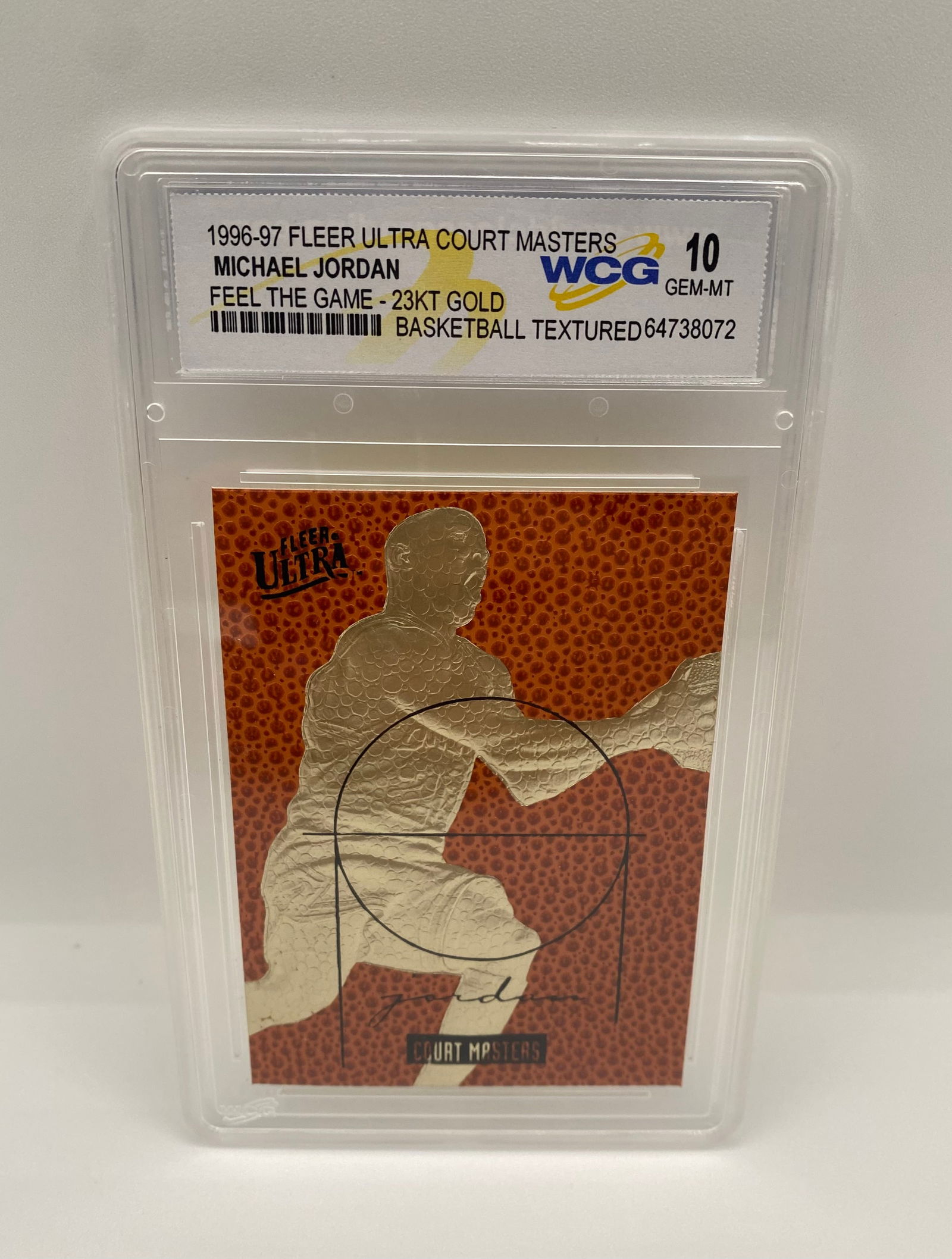 1996-97 Fleer Ultra Court Masters Michael Jordan 23KT Gold - WCG 10 Gem-MT: Part of the elite "Court Masters" series, this 23KT gold-plated card features a textured basketball surface and Michael Jordan in a classic scoring pose. Graded Gem-Mint 10 by WCG. 