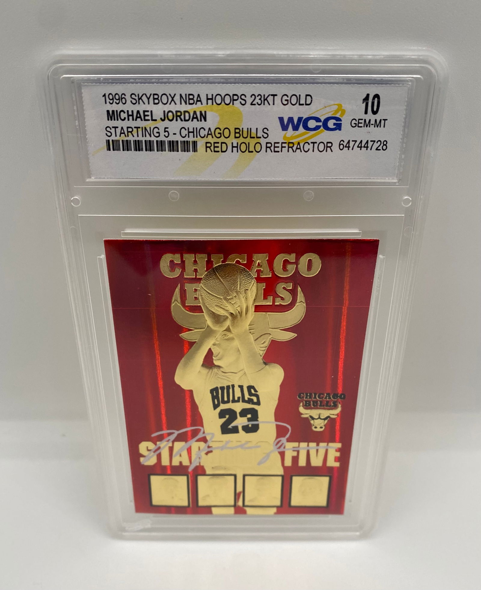 1996 Skybox NBA Hoops Michael Jordan Starting 5 - 23KT Gold Red Holo Refractor - WCG 10: An eye-catching "Starting 5" card featuring a vibrant Red Holo Refractor background and gold-plated MJ imagery. Graded WCG 10 Gem-MT. Features facsimile signatures of the Chicago Bulls legends. 