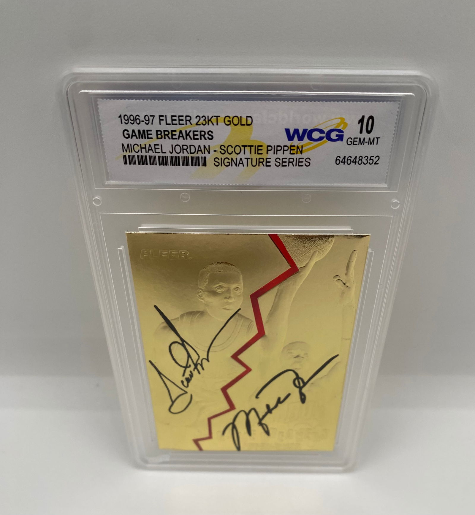 1996-97 Fleer Game Breakers Jordan & Pippen 23KT Gold Signature Series - WCG 10 Gem-MT: Celebrate the greatest duo in NBA history. This 23KT gold-plated "Game Breakers" card features Michael Jordan and Scottie Pippen with facsimile signatures. Graded WCG 10 Gem-MT. 