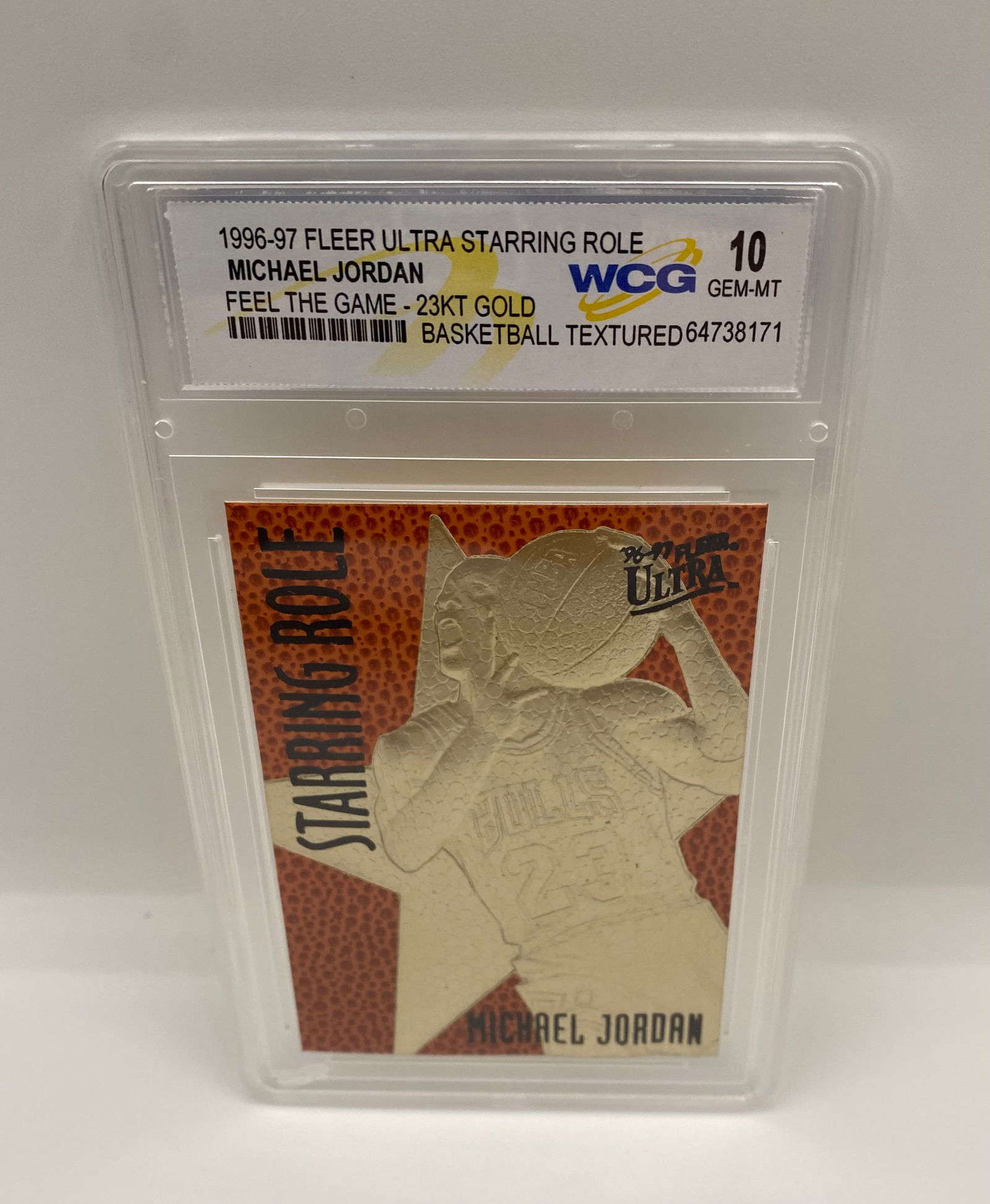 1996 Michael Jordan Fleer Ultra Starring Role 23KT Gold WCG 10 Gem-MT: A stunning tribute to the GOAT, this 1996-97 Fleer Ultra "Starring Role" card is struck in 23KT Gold and features a unique basketball-textured background. Graded a perfect Gem-MT 10 by WCG (World