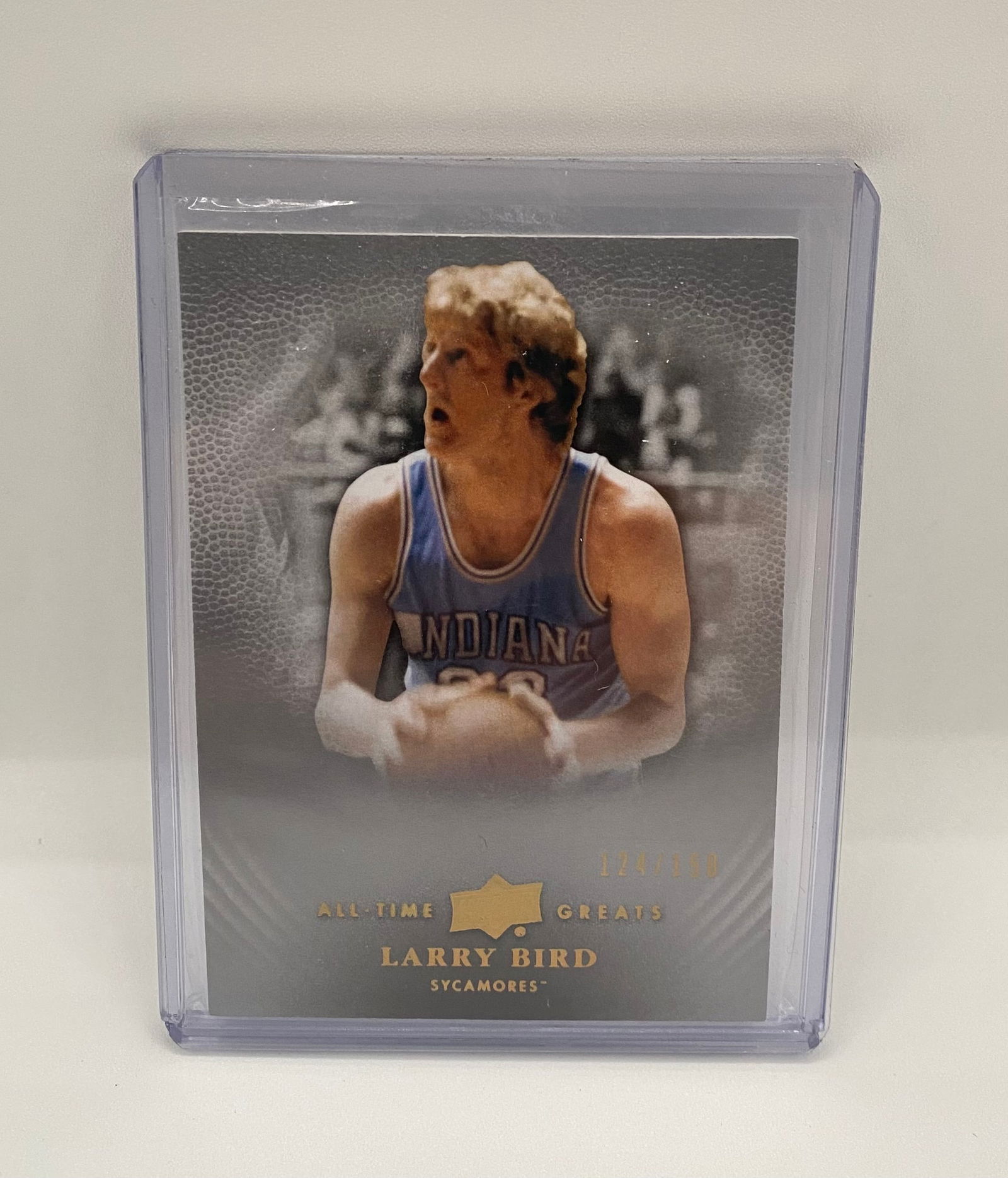 2011 Upper Deck All-Time Greats Larry Bird Indiana Sycamores /150: 2011 Upper Deck All-Time Greats card featuring Larry Bird in his Indiana State Sycamores uniform. Numbered 124/150. Housed in a protective top-loader. Rare collegiate-era tribute to "Larry Legend." 