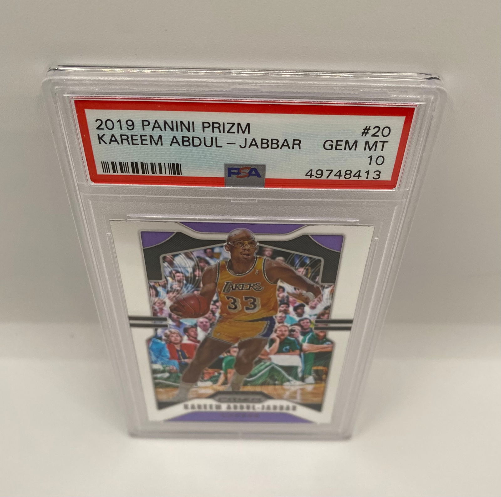 2019 Panini Prizm Kareem Abdul-Jabbar #20 PSA 10 GEM MINT: Pristine 2019 Panini Prizm Kareem Abdul-Jabbar. Graded PSA 10 (Gem Mint). Features the NBA’s legendary center in his Los Angeles Lakers uniform. A perfect addition for Hall of Fame collectors. 