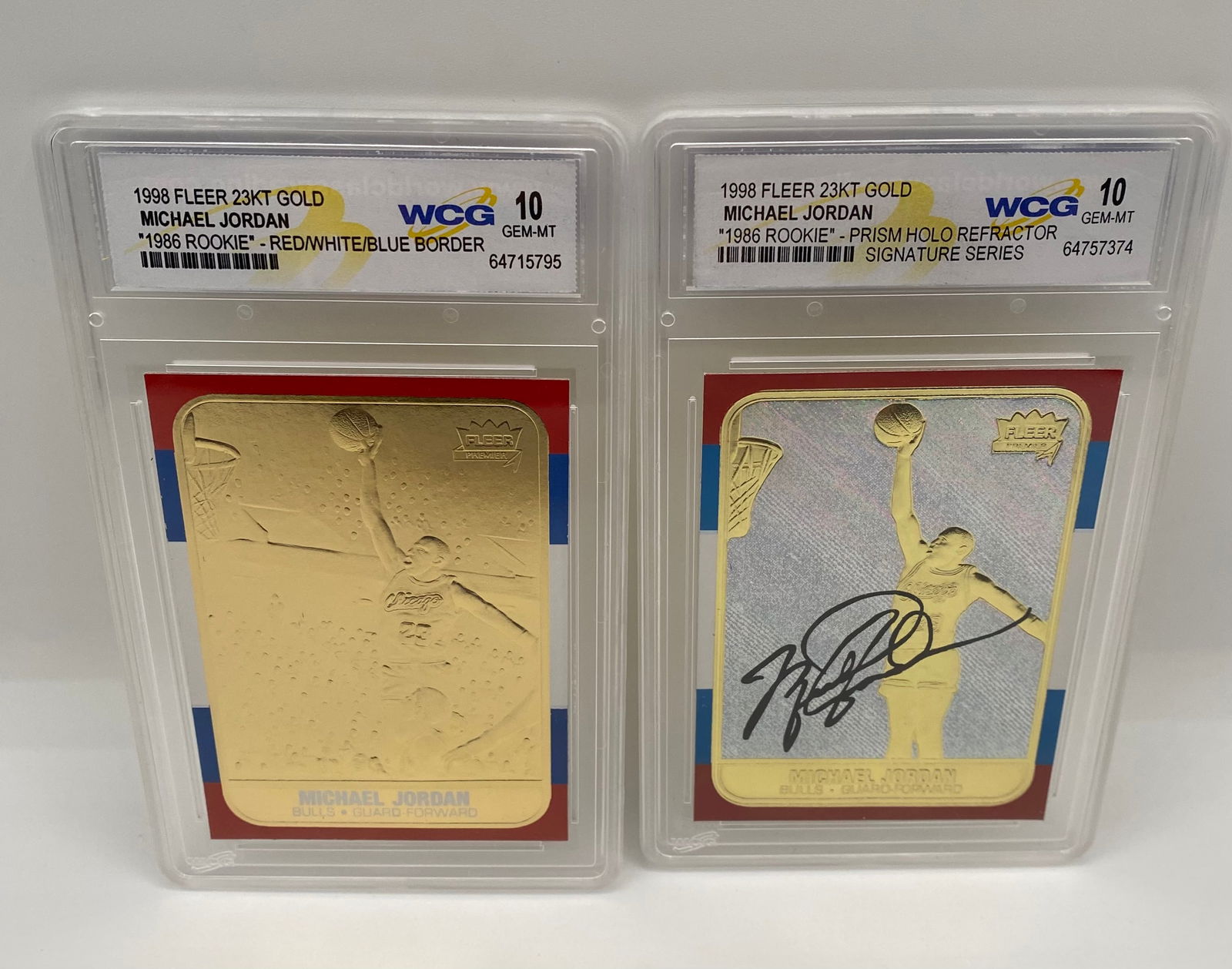 2) Michael Jordan 1998 Fleer 23KT Gold Tribute Cards - WCG 10 Gem-MT: Card 1: 1998 Fleer 23KT Gold "Red/White/Blue Border" variant. • Card 2: 1998 Fleer 23KT Gold "Prism Holo Refractor" Signature Series with facsimile auto. • Details: Both cards are graded W