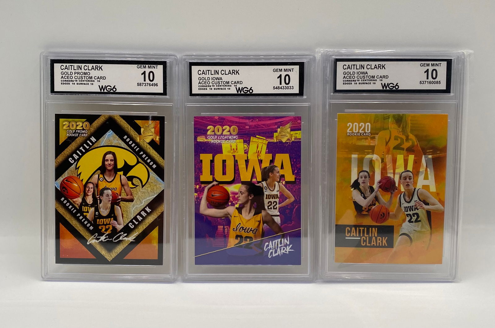 3) Caitlin Clark 2020 Custom ACEO Rookie Cards - WG6 10 Gem-Mint: Collection Includes: (1) Gold Promo Rookie Phenom, (1) Gold Iowa Gold Lightning, (1) Gold Iowa Silhouette variant. • Details: A trio of custom-made ACEO art cards for the NCAA's all-time