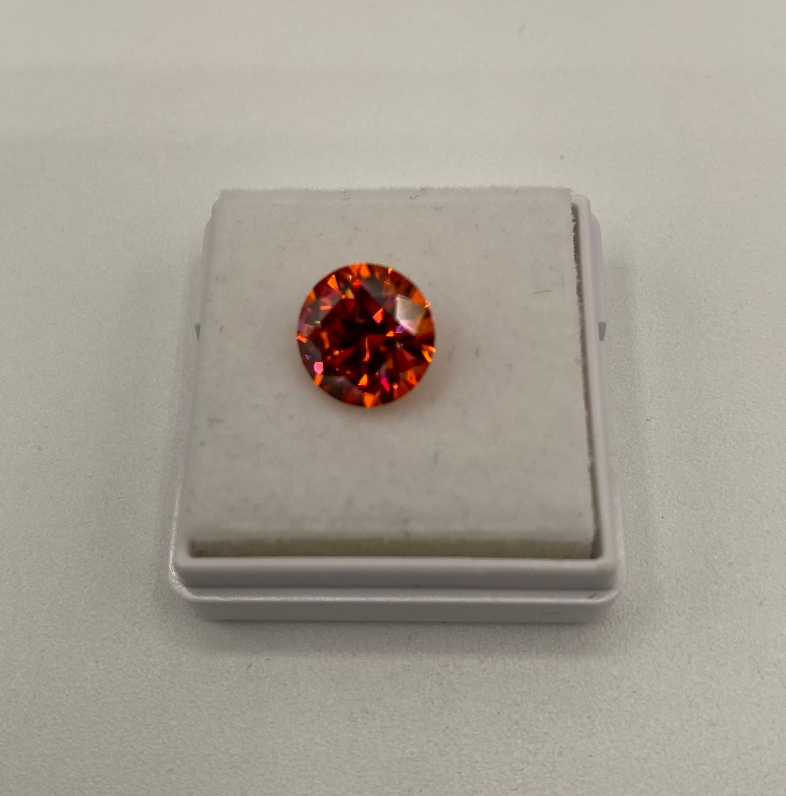 Rare 3.00 CT Deep Fire Orange Moissanite – GRA Certified – Passes Diamond Tester: A rare and deeply saturated 3.00-carat round brilliant cut moissanite. This stone features an intense orange-red "Fire" hue, making it a unique collector's piece or center stone for custom