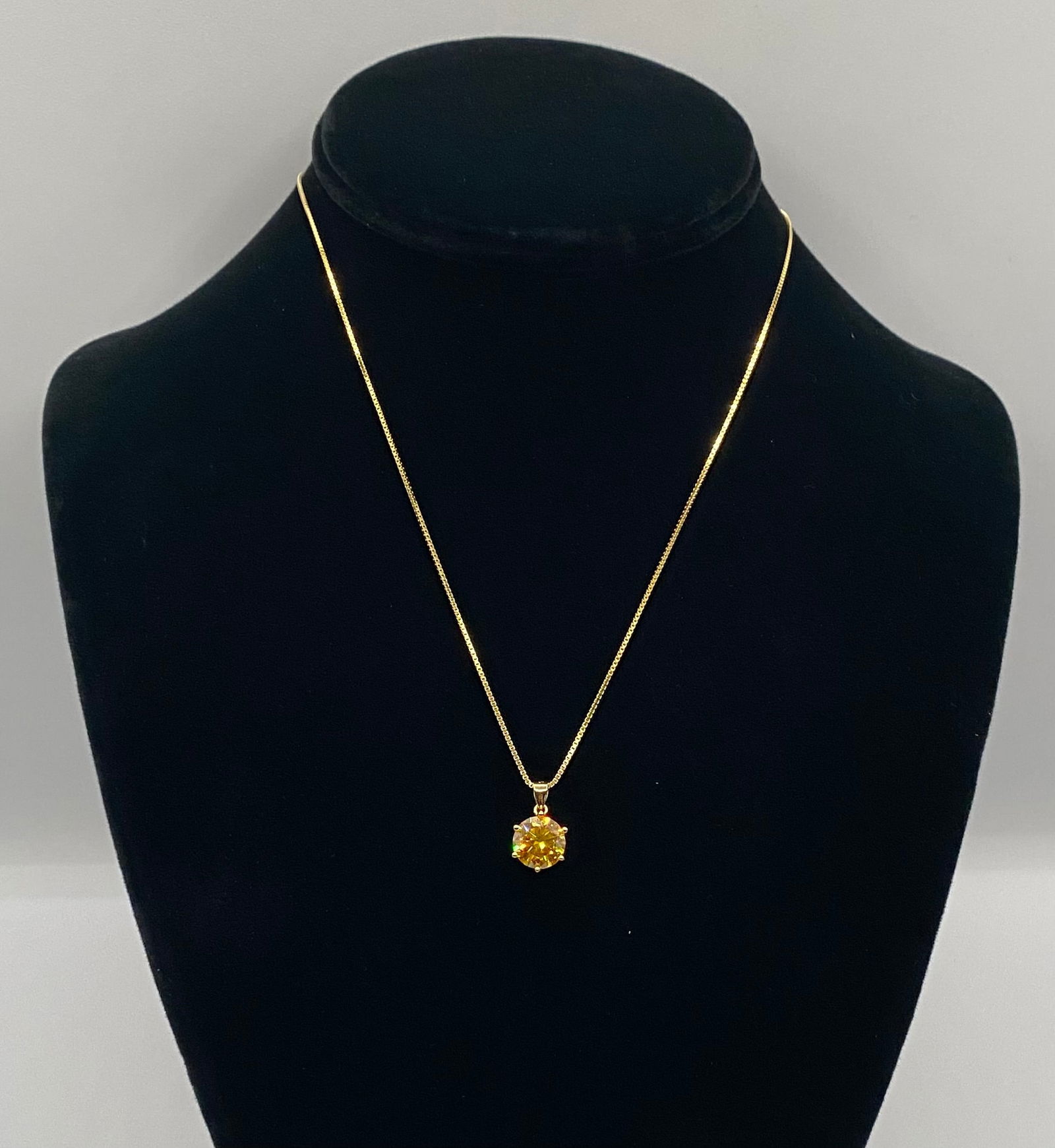Brilliant Round Cut Canary Yellow Moissanite Solitaire Necklace GRA Certified: Gemstone: Genuine Brilliant Round Cut Moissanite. • Color: Striking Canary Yellow. • Metal: Premium 18k Gold Plated over Solid Sterling Silver (S925). • Authentication: Includes