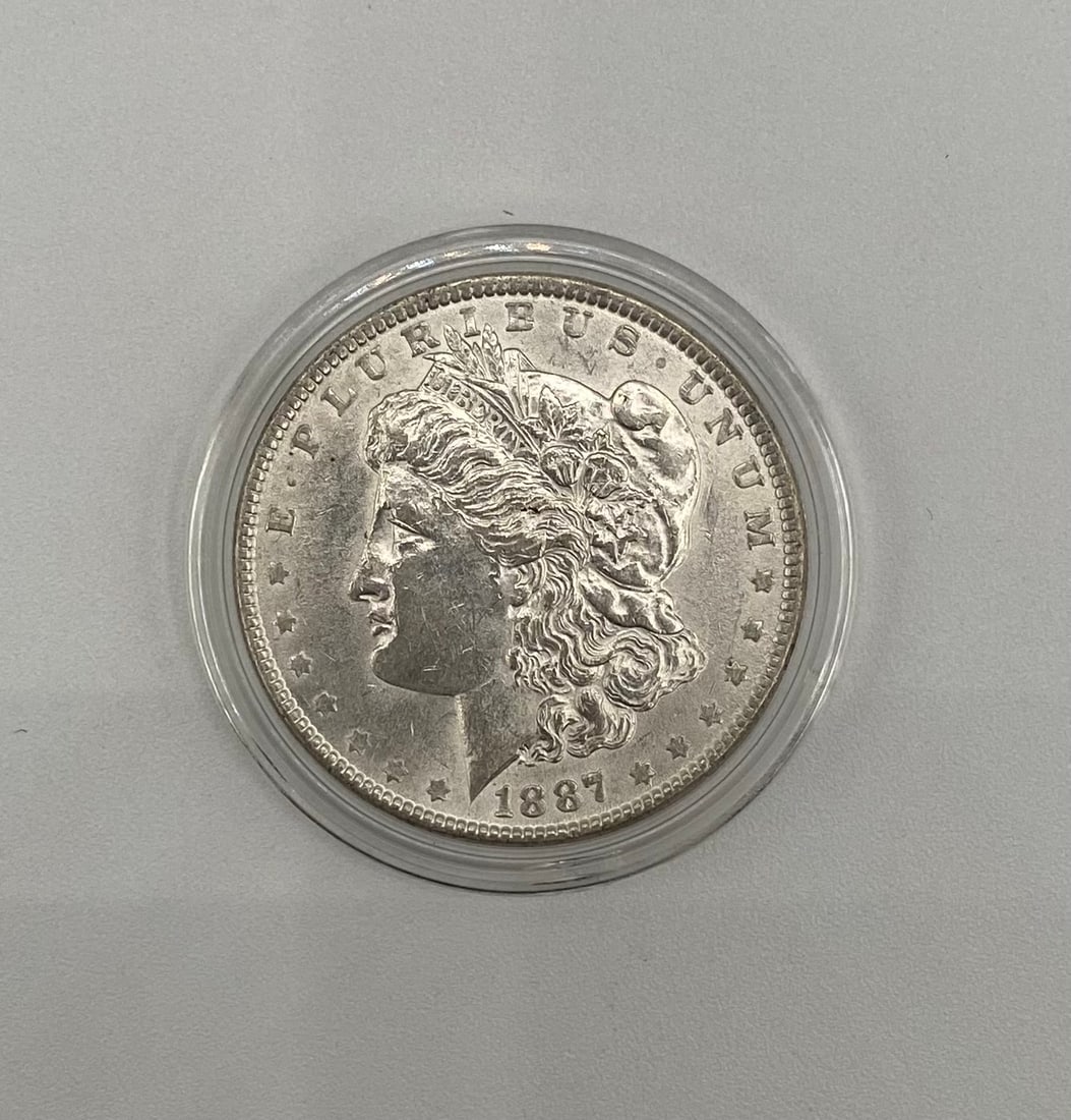 1887 Morgan Silver Dollar - 90% Silver - Protective Capsule (1 of 2)