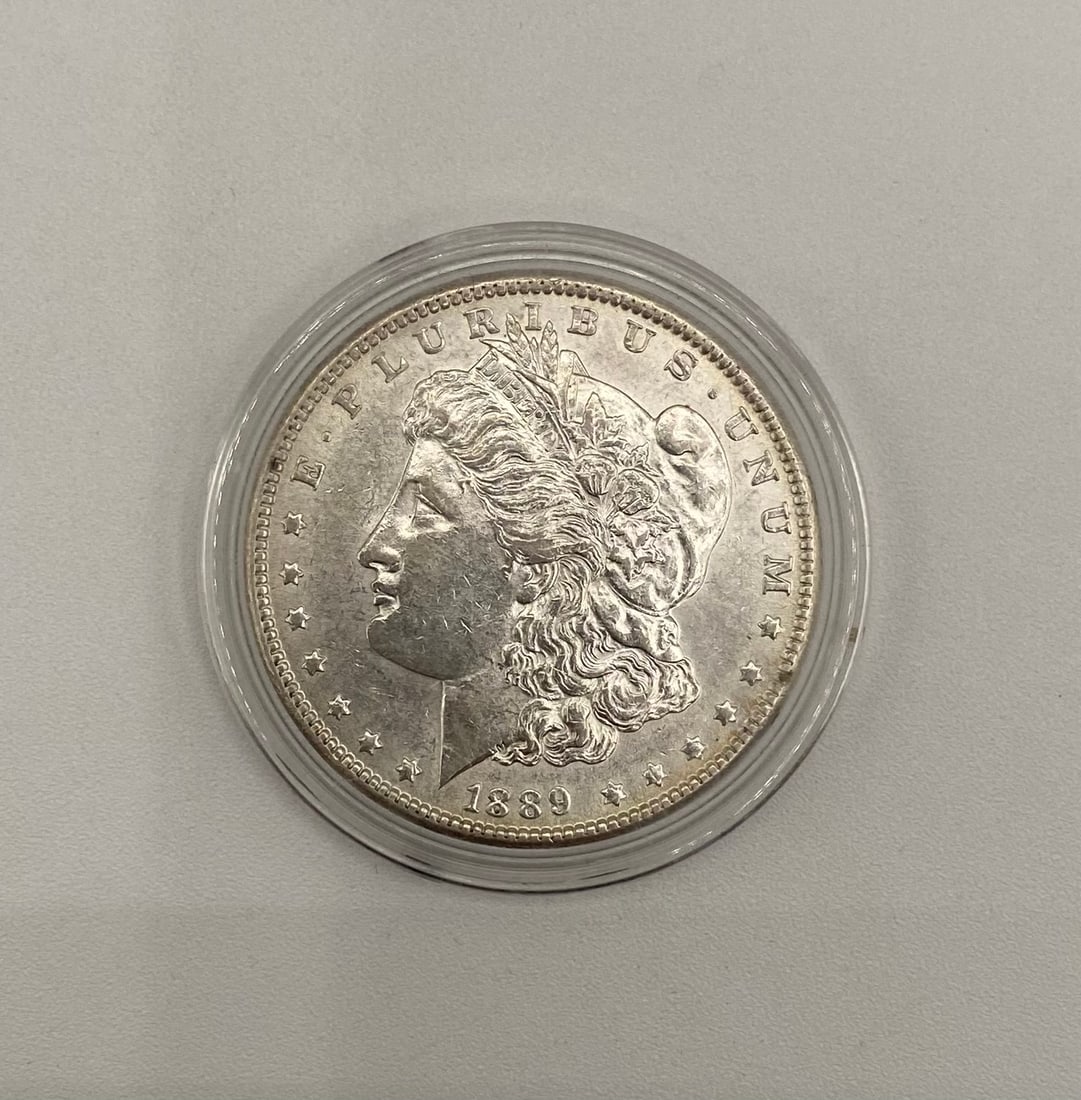 1889 Morgan Silver Dollar - 90% Silver - Protective Capsule (1 of 2)