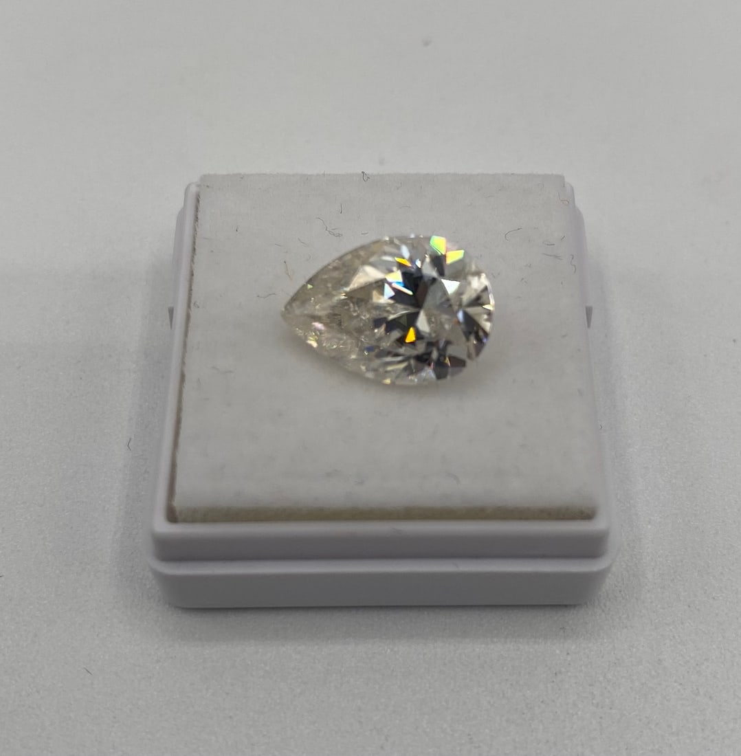 5.00 Carat Pear Shape Brilliant Moissanite – GRA Certified – Passes Diamond Test: Gem Type: Real Moissanite • Shape: Pear (Teardrop) Brilliant Cut • Carat Weight: 5.00 Carats • Key Features: A stunning Pear-shaped stone combining the brilliance of a round cut