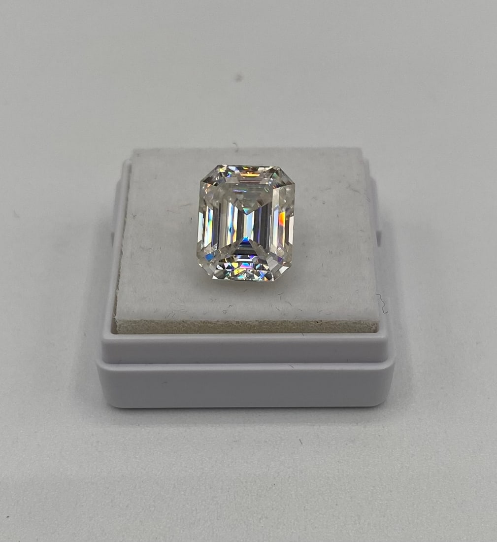 5.00 Carat Emerald Cut Moissanite – GRA Certified – Passes Diamond Test: Gem Type: Real Moissanite • Shape: Emerald Cut (Step Cut) • Carat Weight: 5.00 Carats • Key Features: Featuring sophisticated "hall-of-mirrors" step facets, this Emerald cut