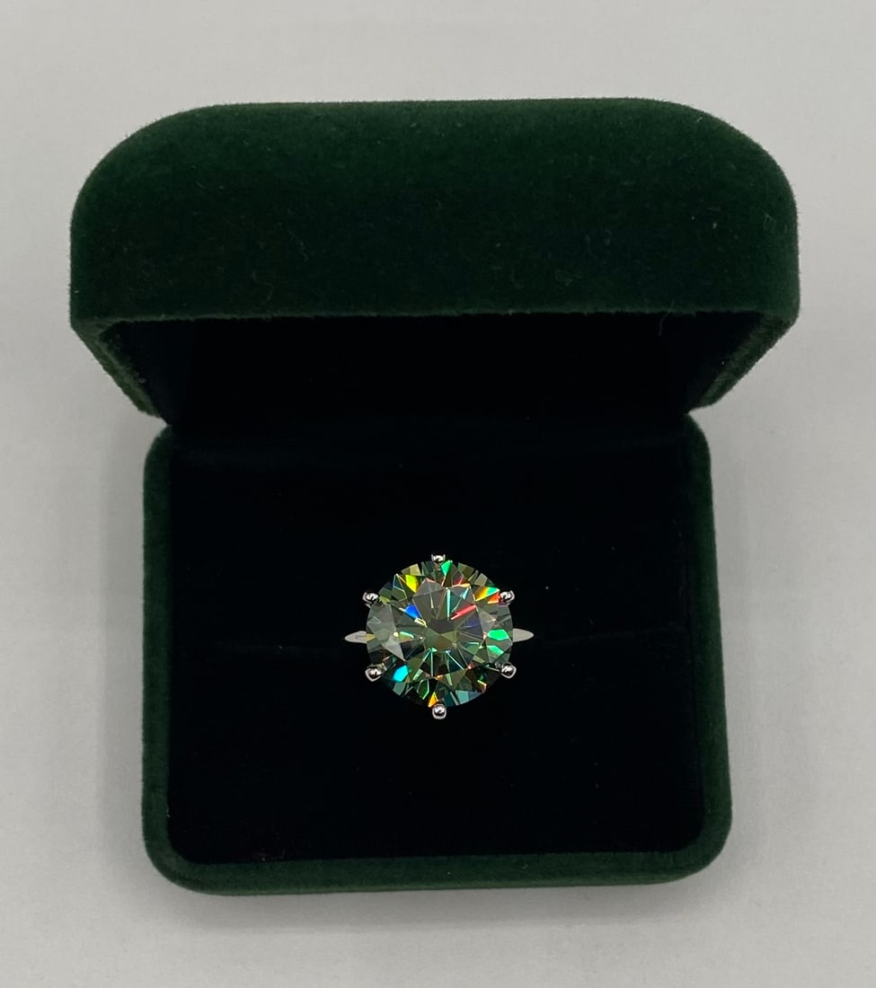 10.00ct Round Brilliant Moissanite Statement Ring - Passes Diamond Tester - GRA Certified: Stone Type: Genuine GRA Certified Moissanite • Carat Weight: 10.00 Carats • Cut: Round Brilliant Cut • Metal: 18k White Gold/Rhodium Plated over Solid .925 Sterling