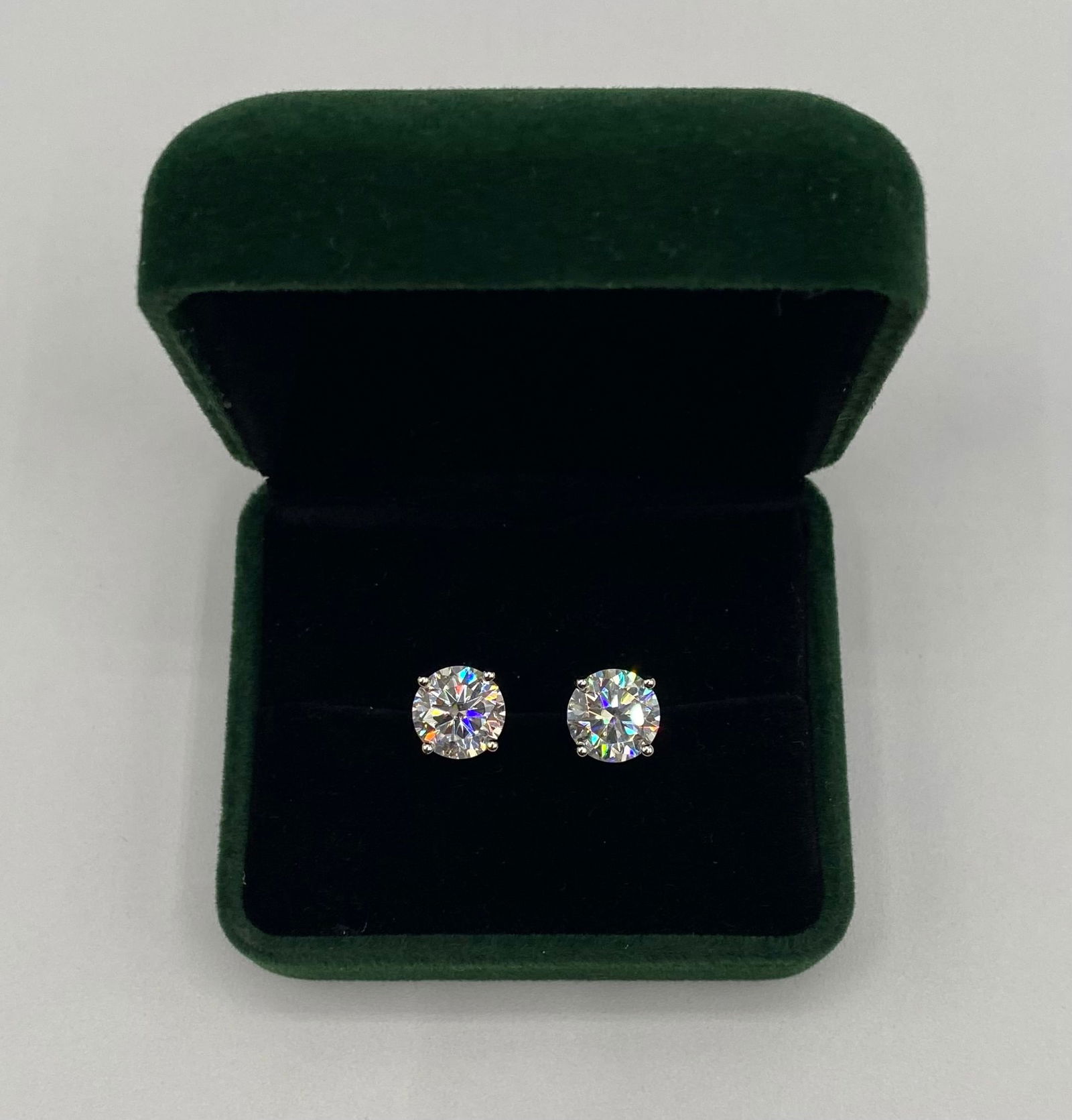 Stunning 6.00 CTW Round Brilliant Moissanite Stud Earrings - 18k Gold over Silver: Elevate your collection with these magnificent round brilliant cut moissanite stud earrings. Featuring a massive total weight of 6 carats, these stones offer a spectacular display of light and "fire"