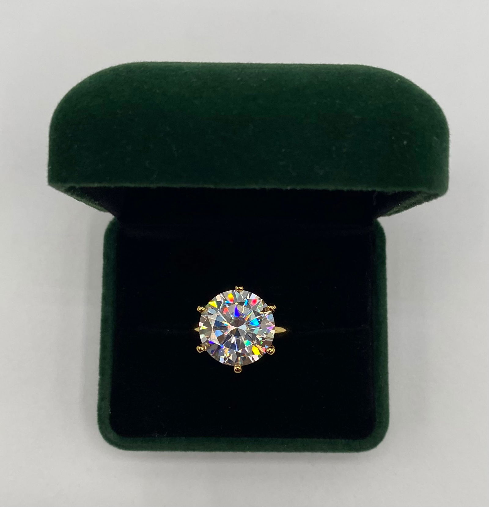 5.00 CTW Round Brilliant Cut Moissanite Ring - 18K Gold Over Sterling - GRA Certified: Up for auction is a stunning 5-carat round brilliant cut moissanite solitaire ring. This stone exhibits exceptional fire and brilliance, characteristic of high-quality moissanite, and offers a