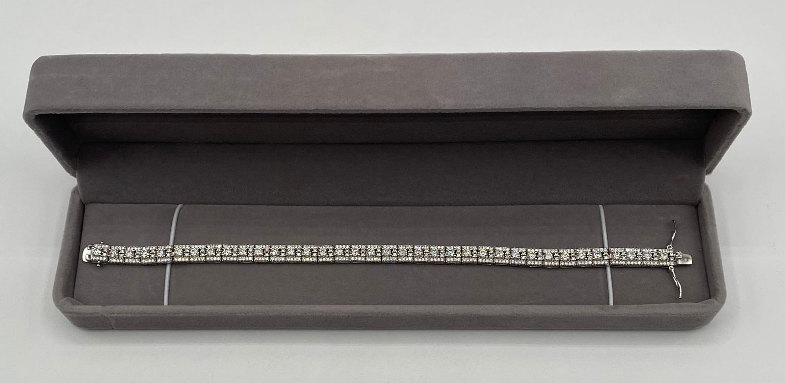 8" Moissanite 2-Row Tennis Bracelet - 18K Gold Plated 925 Silver - GRA Certified - Passes Tester: Style: Luxury 2-Row Brilliant Cut Tennis Bracelet. • Stones: Authentic Moissanite (Certified). • Authentication: Passes as Diamond on thermal diamond testers. Includes GRA Certificate and