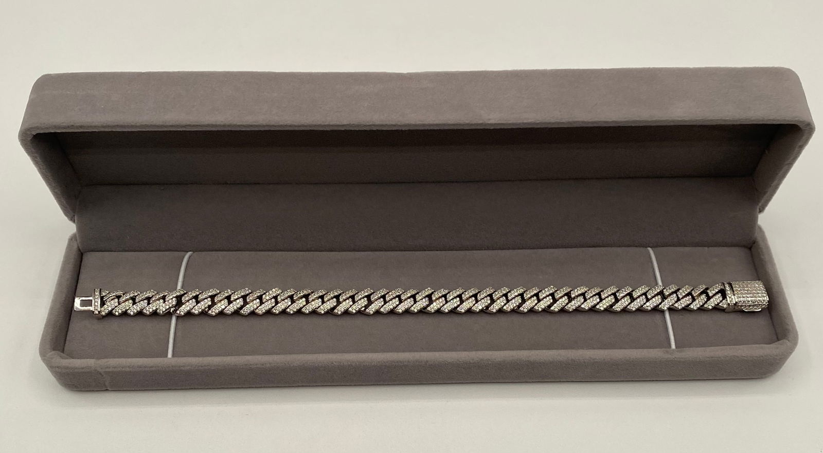 8 inches Iced-Out Moissanite Cuban Link Bracelet - 18K Gold Plated 925 Silver Passes Tester: Style: Miami Cuban Link "Iced-Out" Bracelet. • Stones: Fully micro-paved with authentic Moissanite stones. • Authentication: Stones pass as Diamond on thermal testers. GRA Certificate incl