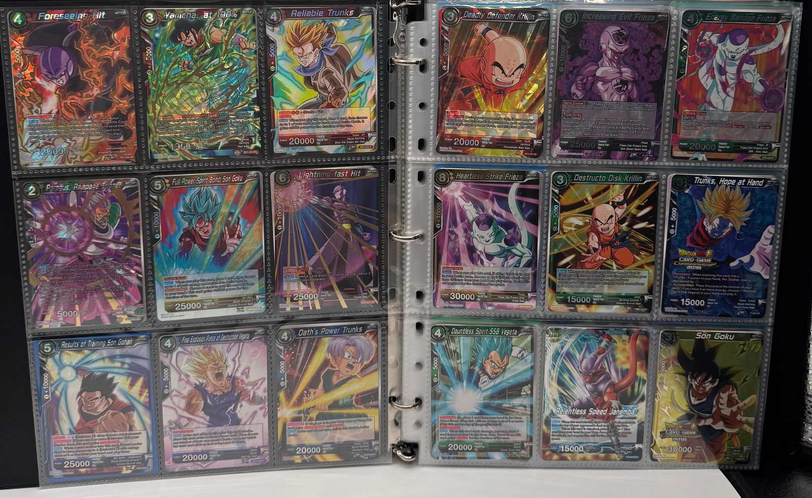 Dragon Ball Super TCG Collection: Holo/SR/Rare Binder Lot (2017-2018 Era): Up for auction is a well-maintained collection of Dragon Ball Super Card Game (Masters) trading cards. This lot features a diverse range of cards from the game’s early expansion sets, including