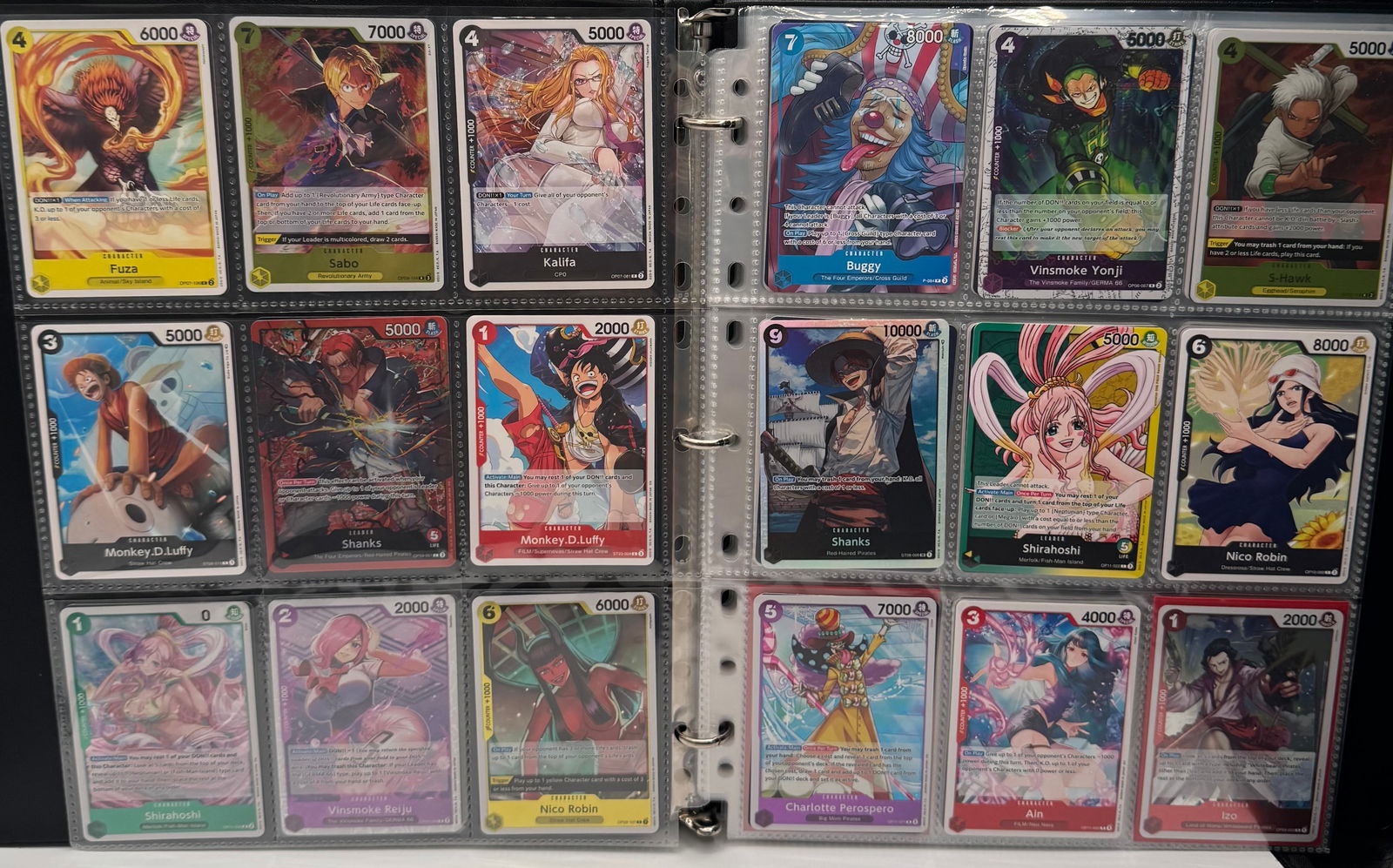 High-Value One Piece TCG Collection - OP-08 Two Legends - Rare/Super Rare Binder: Up for auction is a premium collection of One Piece Trading Cards, primarily featuring the sought-after OP-08 Two Legends expansion. This lot includes an impressive array of Super Rare (SR), Rare (R),