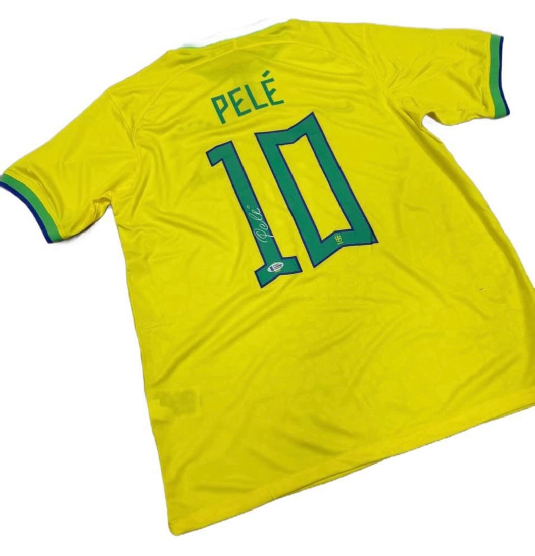 Pelé Autographed Brazil National Team Jersey Beckett Authenticated The King: Player: Pelé (Edson Arantes do Nascimento) • Team: Brazil National Team • Details: Iconic yellow home jersey featuring the legendary #10. Boldly signed by Pelé on the