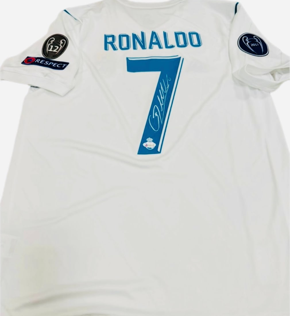 Cristiano Ronaldo Autographed Signed Real Madrid Jersey – Beckett Authenticated: Player: Cristiano Ronaldo (CR7) • Team: Real Madrid C.F. • Details: White Real Madrid home jersey featuring the legendary #7. Includes Champions League/Respect patches on the sleeves.