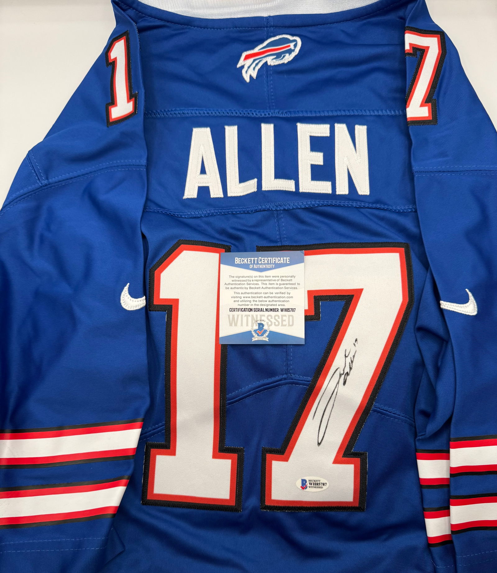 Josh Allen Signed Buffalo Bills Jersey – Beckett Witnessed Authentic: A fantastic collectible featuring the signature of Buffalo Bills powerhouse quarterback Josh Allen. This Bills-style jersey is hand-signed on the reverse #17 in black ink. • Authentication: