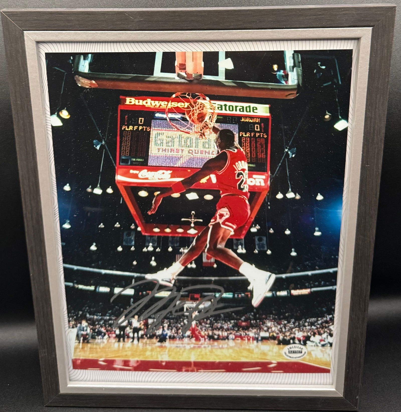 Michael Jordan Signed Framed 16x20 Photo - 1988 Slam Dunk Contest - COA: This is a premier addition to any sports memorabilia collection: a professionally framed 16x20 photograph featuring the iconic "Slam Dunk Contest" flight of Michael Jordan. The image captures Jordan