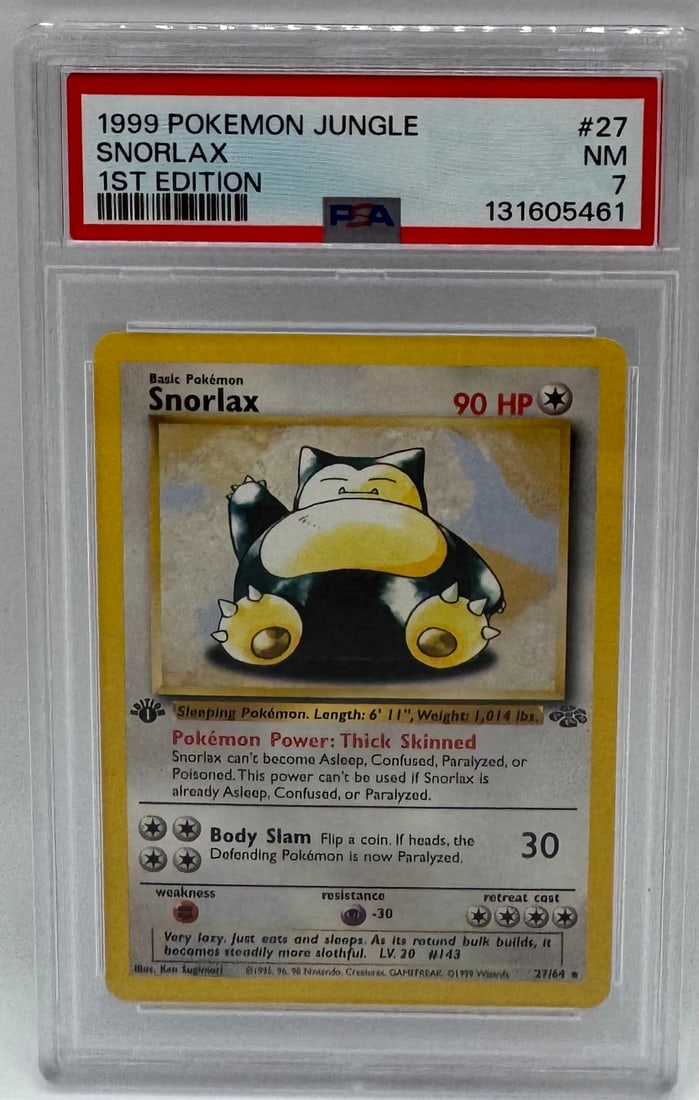 1999 Pokémon Jungle Snorlax 1st Edition: A pristine 1st Edition non-holo Snorlax from the Jungle expansion. Features the iconic "1st Edition" stamp on the left side of the card. • Grade: PSA 7 (Near Mint) • Cert Number: