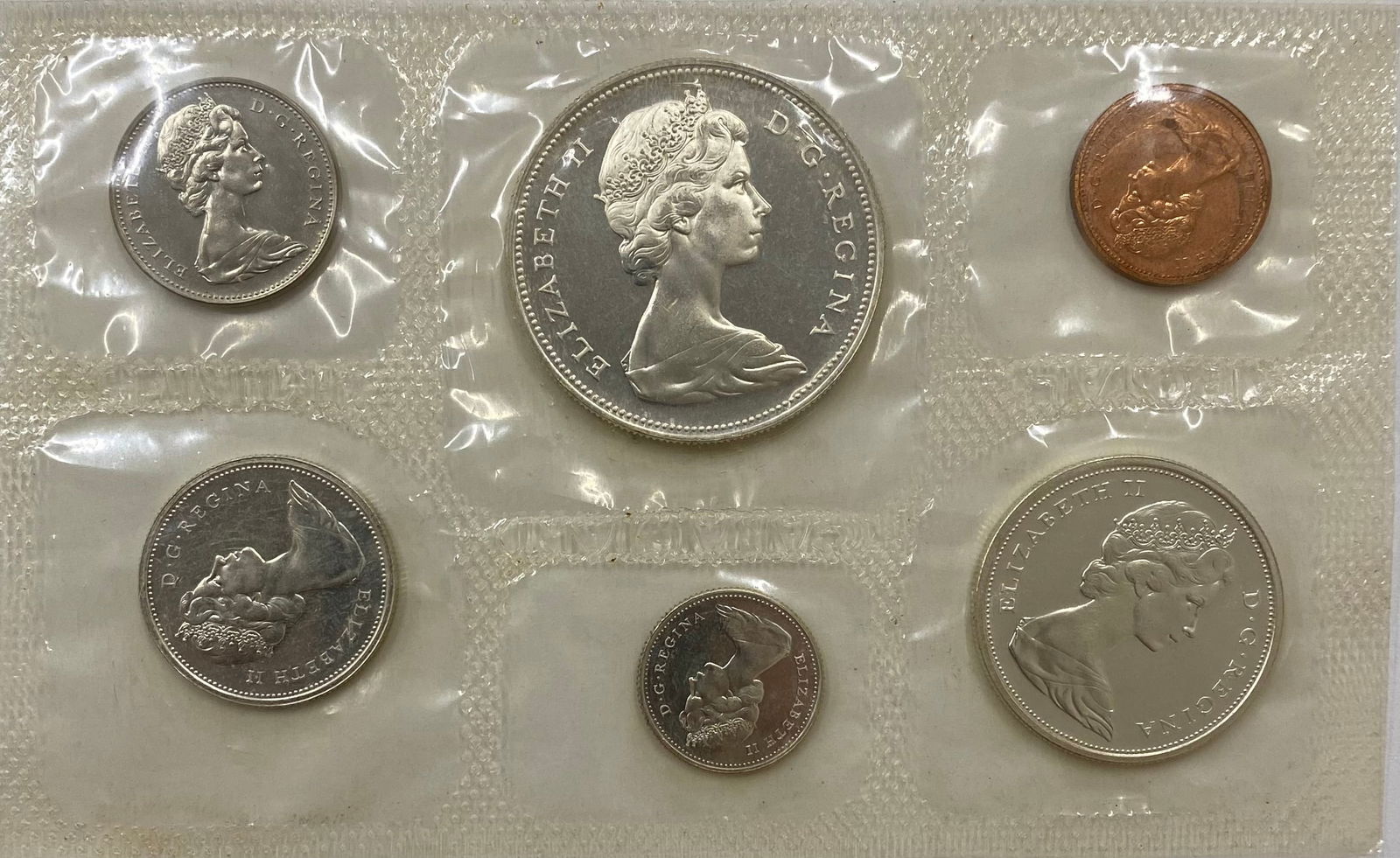 1981 Royal Canadian Mint Uncirculated 6-Coin Proof-Like Set: A complete 1981 Canadian uncirculated coin set housed in the original Royal Canadian Mint transparent pliofilm packaging. The set includes the Nickel Dollar, 50-cent piece, 25-cent piece, 10-cent