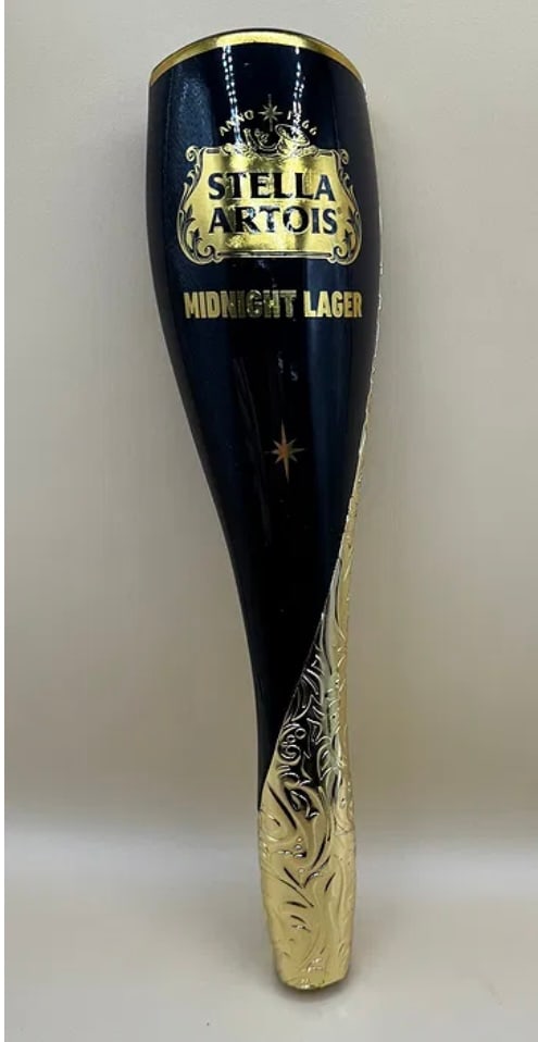 Stella Artois Midnight Lager Beer Tap Handle Limited Edition Black & Gold: An elegant, modern tap handle for Stella Artois Midnight Lager. This handle features a sophisticated matte black finish with premium gold foil branding and intricate filigree scrollwork wrapping aroun