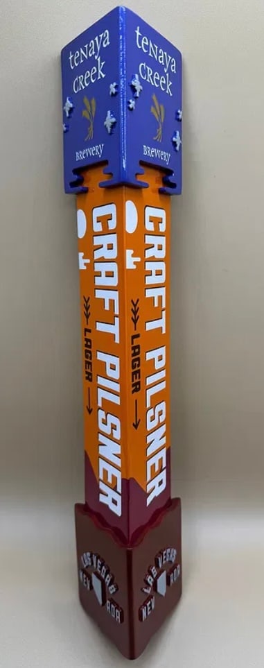 Tenaya Creek Brewery Craft Pilsner Beer Tap Handle Las Vegas Nevada: A vibrant, multi-sided tap handle from Las Vegas-based Tenaya Creek Brewery for their Craft Pilsner. The handle features a unique purple top with 3D raised hop icons and a bright orange body with