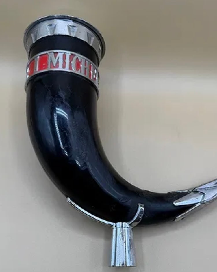 Michelob Rare Sculpted Black Viking Horn Beer Tap Handle: A standout, heavy-duty tap handle designed as a curved Viking drinking horn. Features a black polished body with chrome-tone accents and a red "Michelob" band near the rim. Includes a chrome-finished
