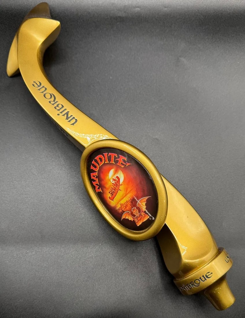 Rare Unibroue "Maudite" Figural Beer Tap Handle - Golden Serpent Shape: A highly collectible and unique tap handle from the Canadian brewery Unibroue for their "Maudite" (The Damned) amber ale. The handle features a striking curved, golden serpent-like design with an oval