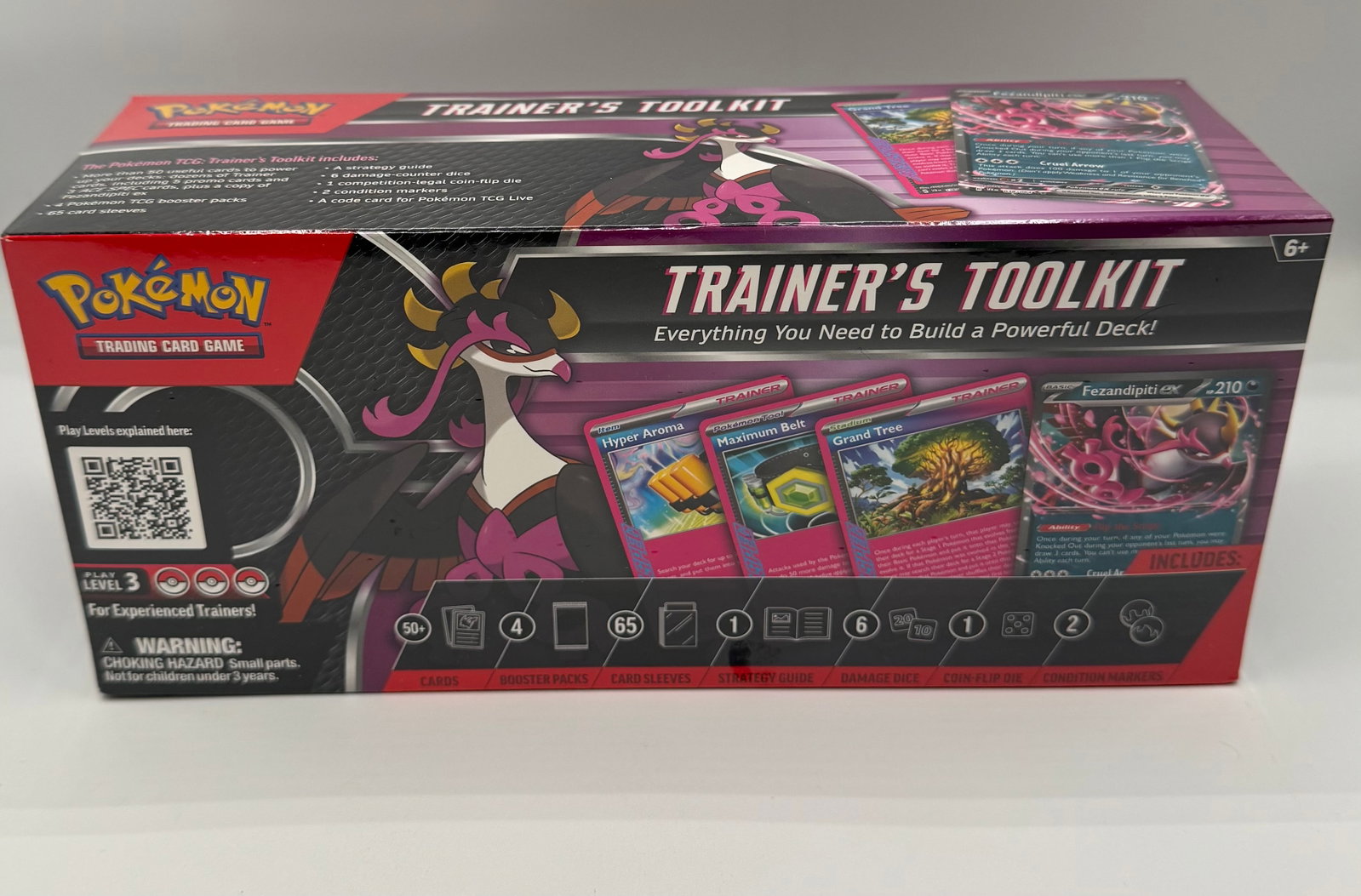 Pokémon TCG: Trainer's Toolkit - Featuring Fezandipiti ex sealed: New, factory-sealed Trainer’s Toolkit. Includes everything needed to build a competitive deck: 50+ useful cards (including Fezandipiti ex and ACE SPEC cards), 4 Booster Packs, 65 card sleeves,