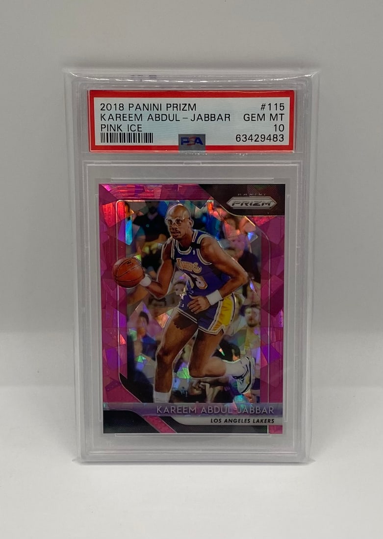 2018 Panini Prizm Kareem Abdul-Jabbar Pink Ice: Legend Kareem Abdul-Jabbar featured in the popular Pink Ice Prizm parallel. This card features the NBA's second all-time leading scorer in his Lakers uniform. Graded a flawless PSA 10 Gem