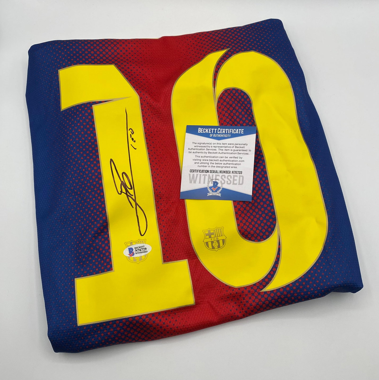 Lionel Messi Autographed Jersey Beckett Witnessed COA: An elite piece of global sports history featuring the signature of the legendary 8-time Ballon d'Or winner, Lionel Messi. Signed beautifully in black marker on the iconic yellow number "10", complete 
