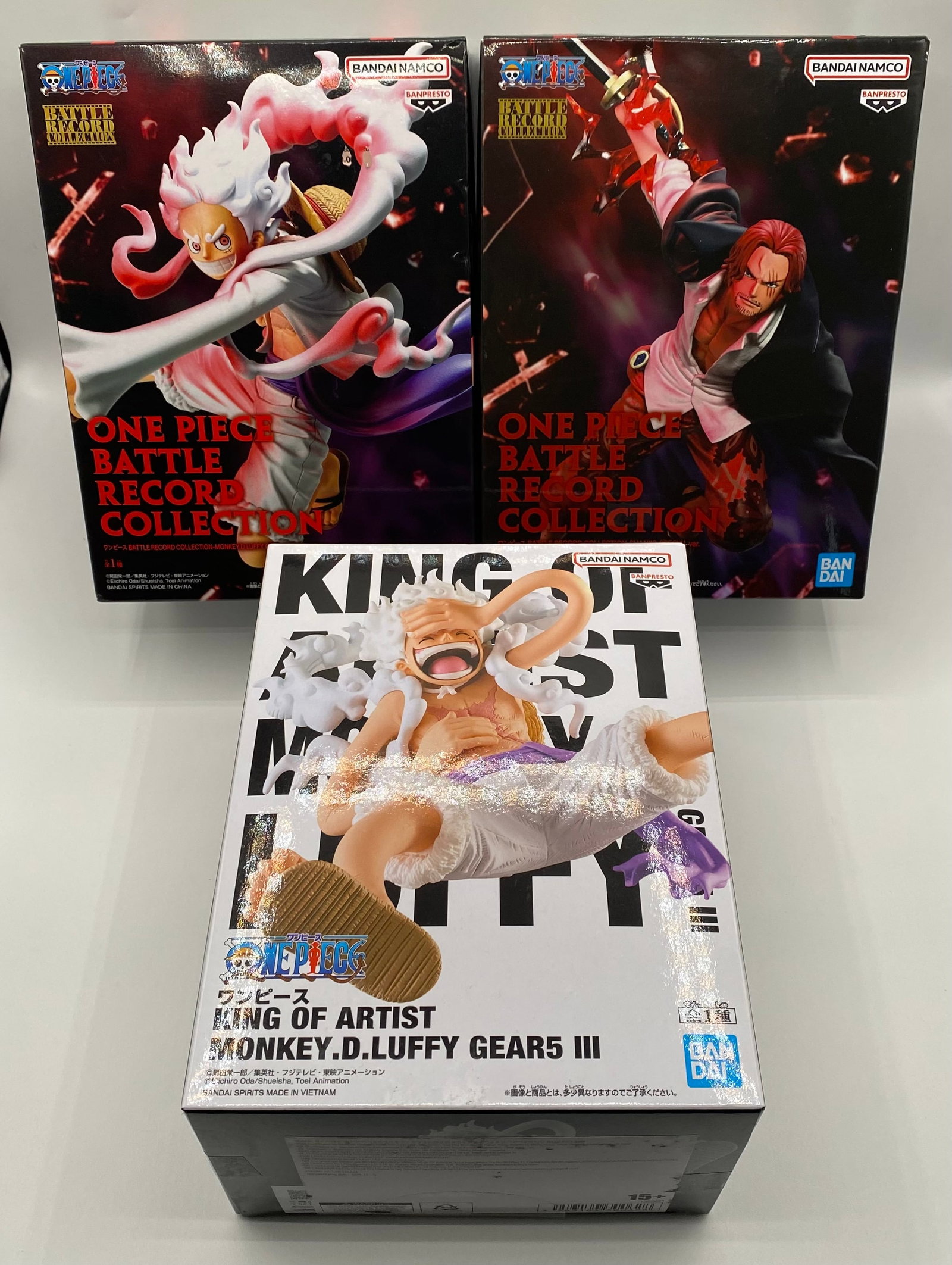 Lot of 3 One Piece Bandai Spirits Figures: Gear 5 Luffy & Shanks - NIB: An excellent lot of three (3) authentic, officially licensed One Piece anime figures manufactured by Bandai Spirits. This collection highlights Monkey D. Luffy’s iconic "Gear 5" transformation