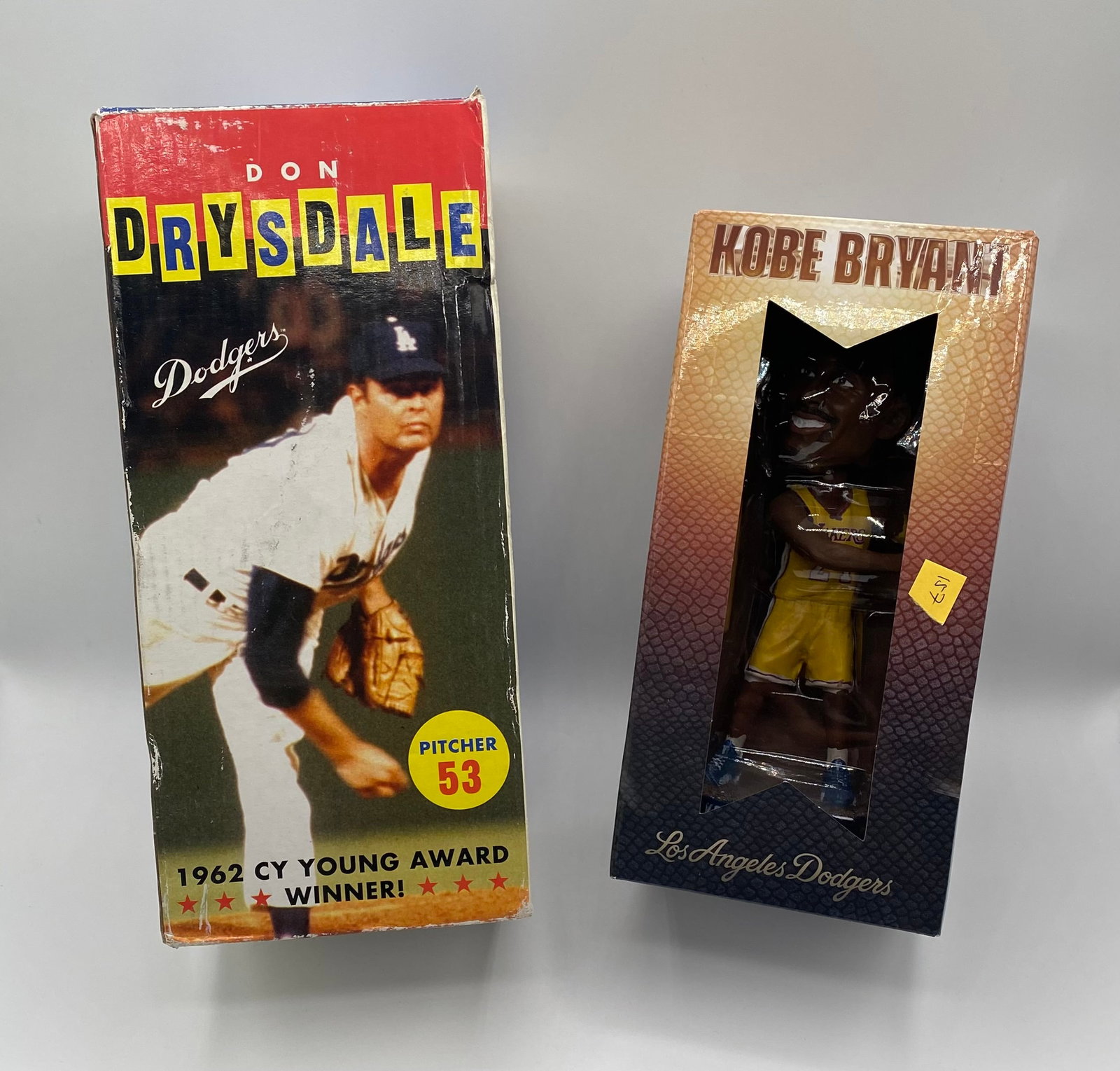 Pair of Los Angeles Sports Bobbleheads: Don Drysdale & Kobe Bryant "Mamba Forever" Dodgers SGA: Item 1: Don Drysdale Los Angeles Dodgers Bobblehead Features: Commemorating his 1962 Cy Young Award season. The box features iconic imagery, his jersey #53, and a classic quote from an unnamed